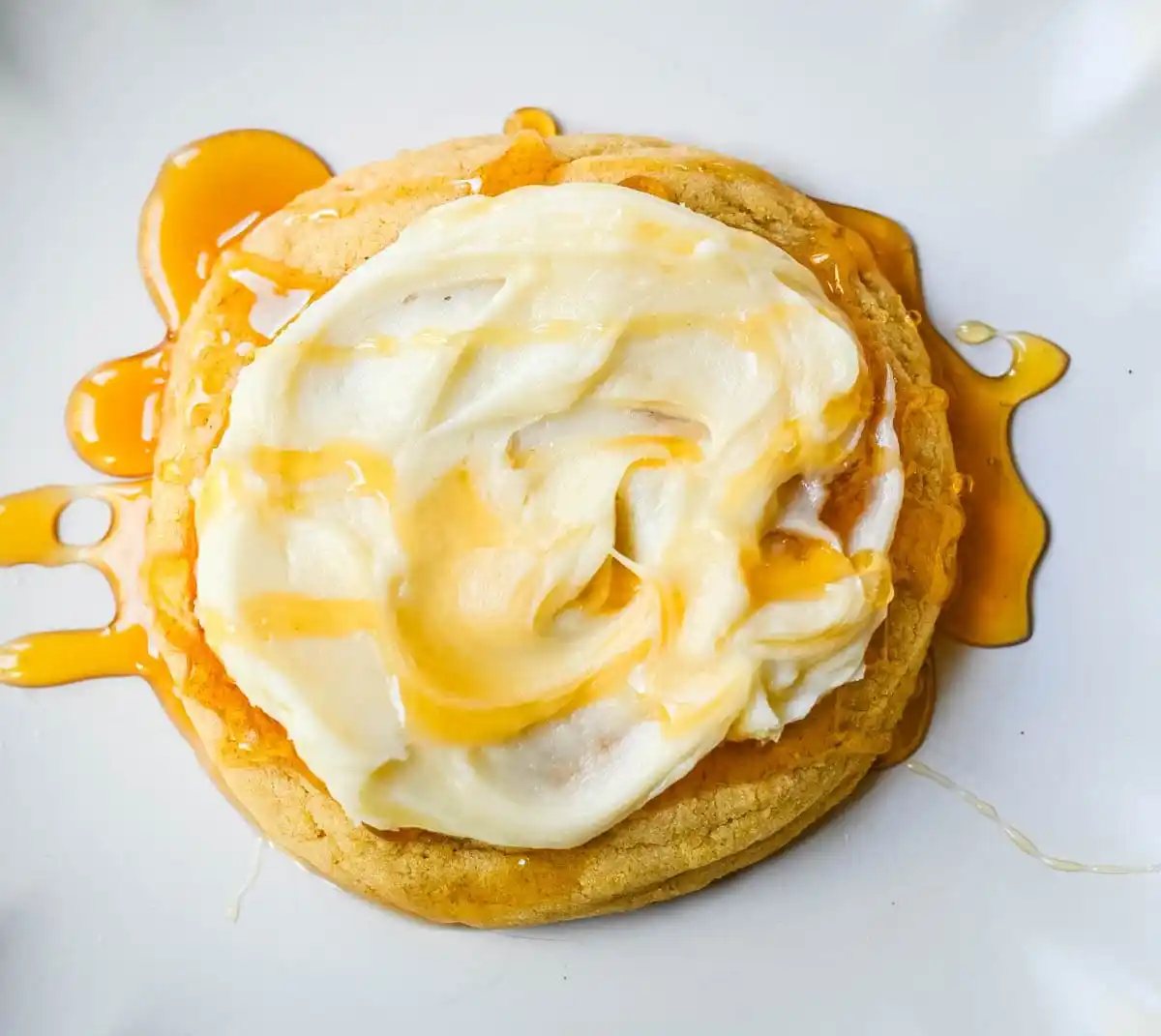 Turn your favorite cornbread into a cookie! These soft cornbread cookies have crisp golden edges, a tender cornmeal crumb, and whipped honey butter on top. Better than Crumbl!