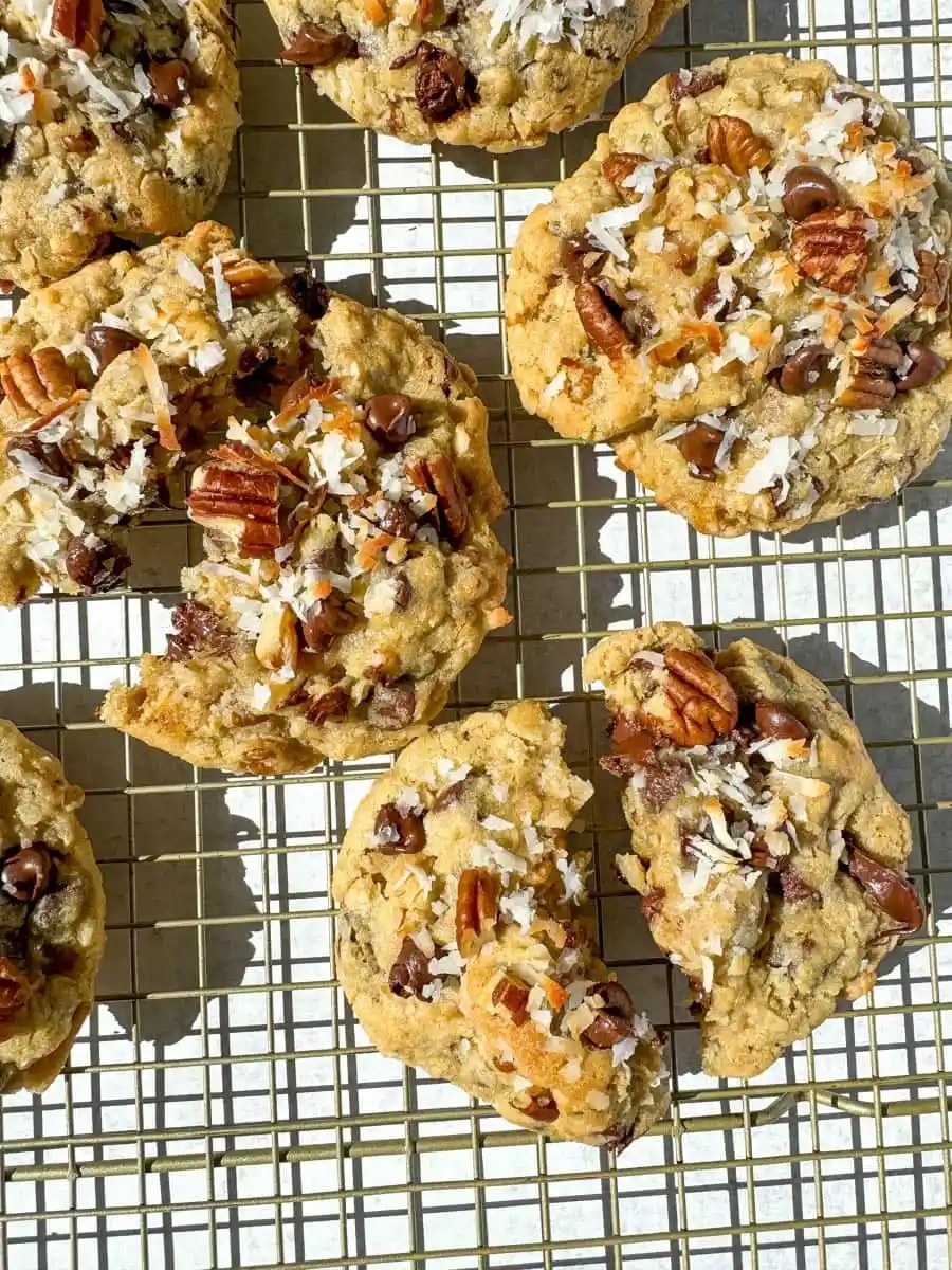 These soft, chewy, chunky Cowboy Cookies are made with oats, chocolate chips, shredded coconut, and pecans making them perfectly sweet, salty, nutty, and hearty. This is the best Cowboy Cookies recipe!