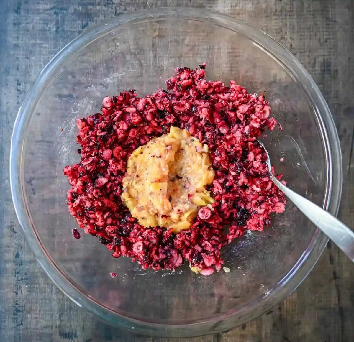 Cranberries and Pineapple in a bowl to make homemade cranberry fluff salad