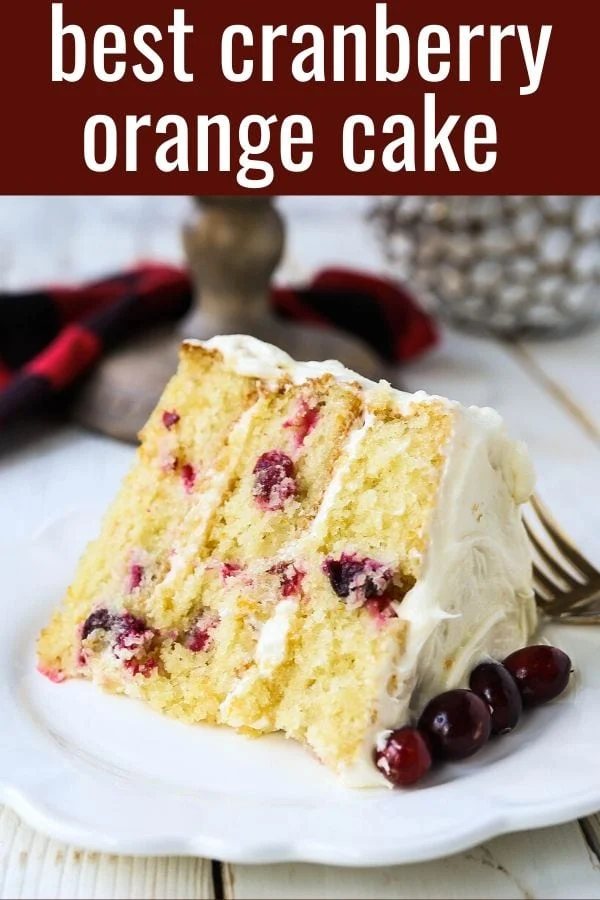Cranberry Orange Cake. A moist orange zest cake with fresh cranberries with a sweet cream cheese orange frosting. A sweet yet tart holiday cake. www.modernhoney.com #cranberry #cranberrycake #cranberryorange #cranberryorangecake