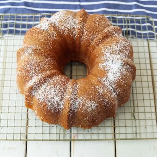 The BEST Cream Cheese Pound Cake. How to make the perfect pound cake in a bundt pan. Buttery cream cheese pound cake goes with everything! This is such a popular cake that is wonderful on its own or in a trifle or berry compote. www.modernhoney.com #poundcake #bundtcake #cake #creamcheesecake