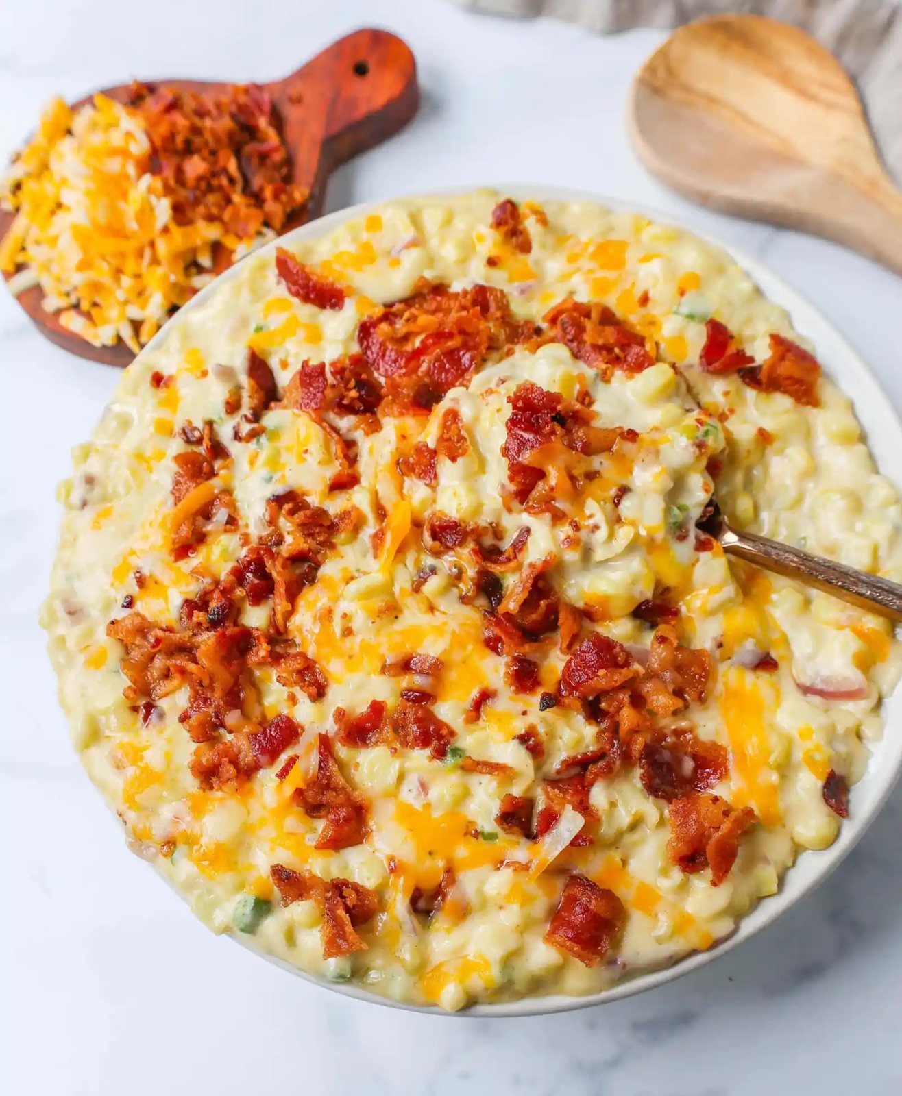 This homemade creamed corn with crispy bacon is the perfect easy side dish recipe. This is always the biggest hit at any dinner and the first vegetable side dish to be finished.