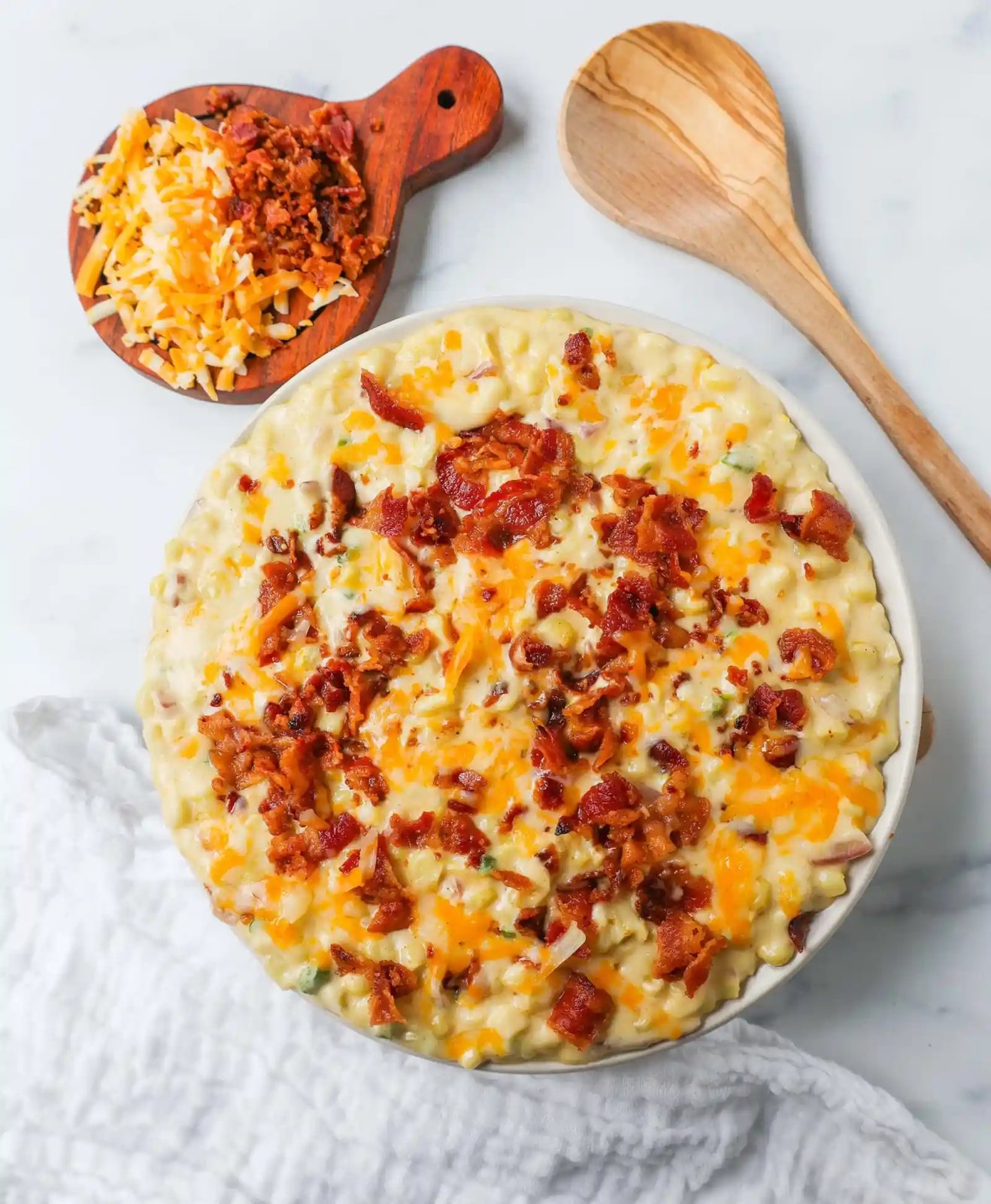 This homemade creamed corn with crispy bacon is the perfect easy side dish recipe. This is always the biggest hit at any dinner and the first vegetable side dish to be finished.