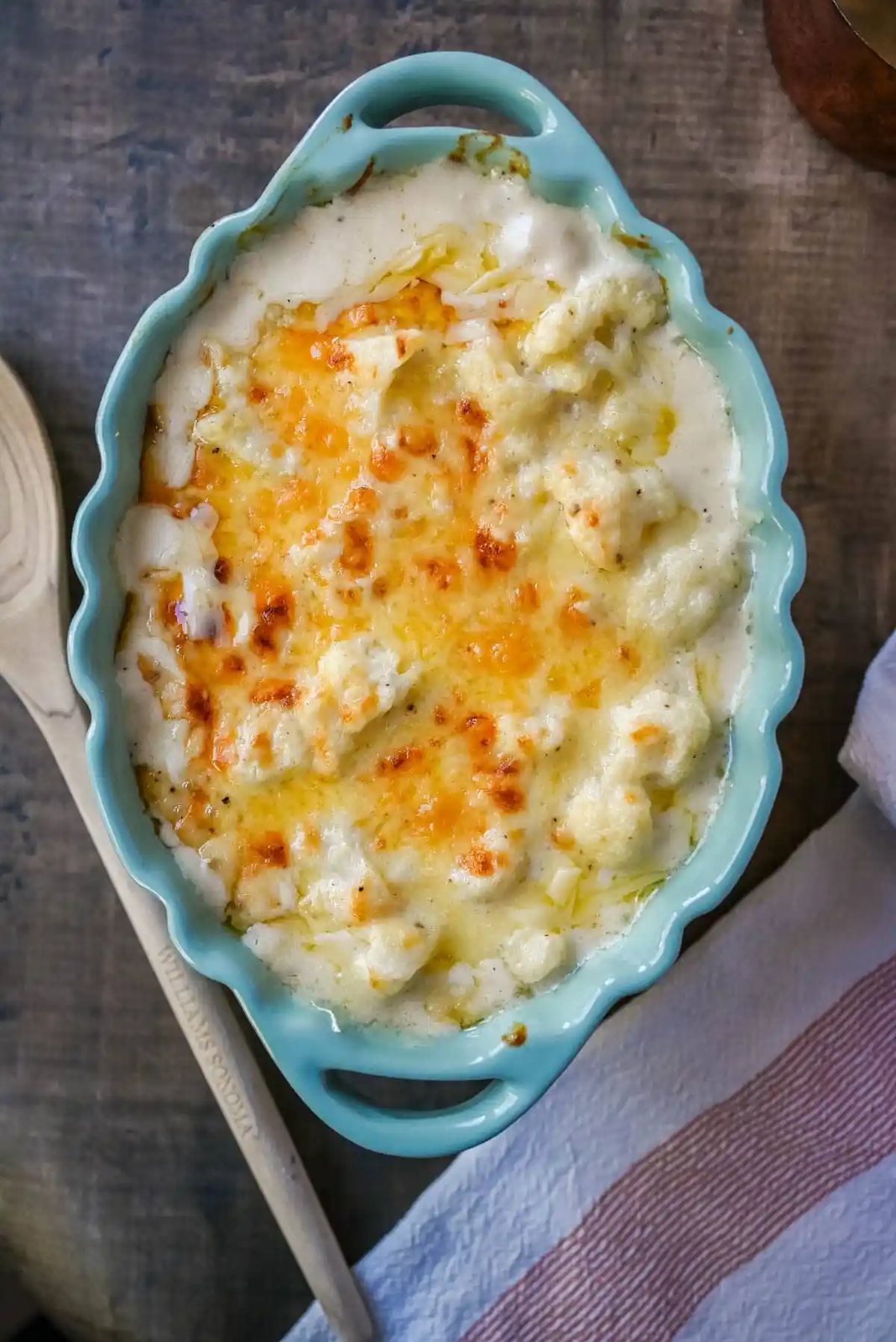 This easy creamy cauliflower gratin is the perfect cheesy side dish for Thanksgiving, Christmas, or any dinner. Made with Gruyère, sharp cheddar, and tender cauliflower, it’s a rich, flavorful, and easy side. The best baked cauliflower gratin!