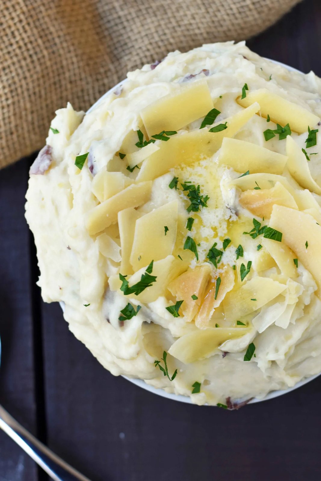 Creamy Parmesan Mashed Potatoes are the perfect mashed potatoes. Rich and creamy potatoes with butter, half-n-half, sour cream, and parmesan cheese. The most flavorful and creamy mashed potatoes! A popular side dish. www.modernhoney.com