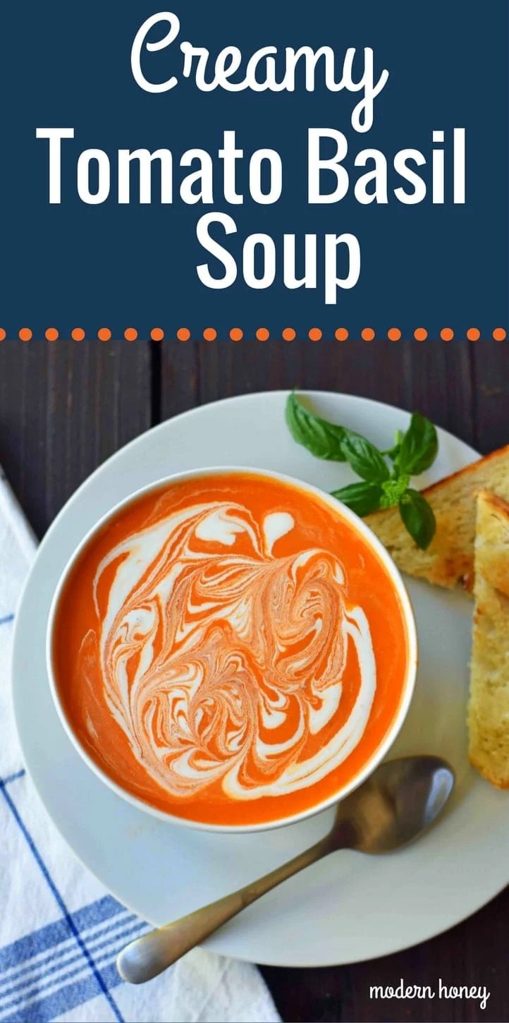 Creamy Tomato Basil Soup is the best cream of tomato soup. This Creamy Tomato Basil Soup Recipe using sauteed onions, garlic, tomatoes, chicken broth, basil, and heavy cream. You will never eat canned tomato soup again! The best creamy tomato soup recipe. www.modernhoney.com