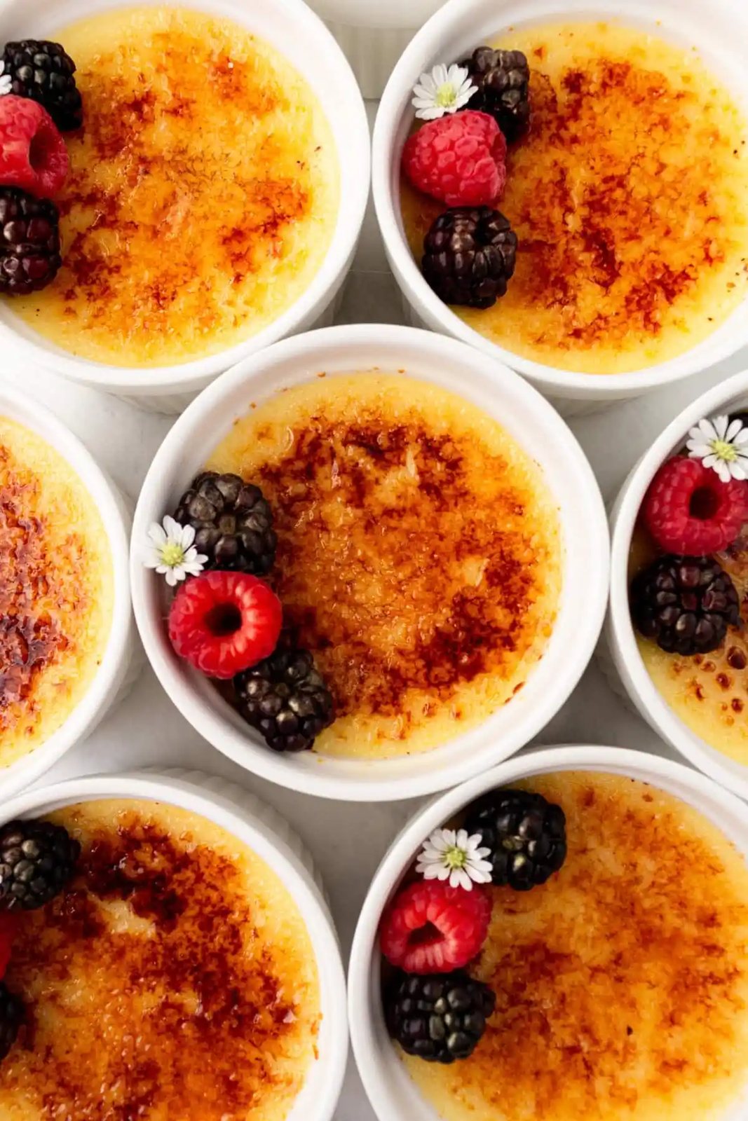 Creme Brulee in ramekins. A creamy, silky vanilla custard topped with crisp sugar crust is one of the most popular desserts at restaurants for good reason. With its silky custard base and crackly caramelized sugar topping, it’s a showstopper that’s surprisingly easy to make at home.