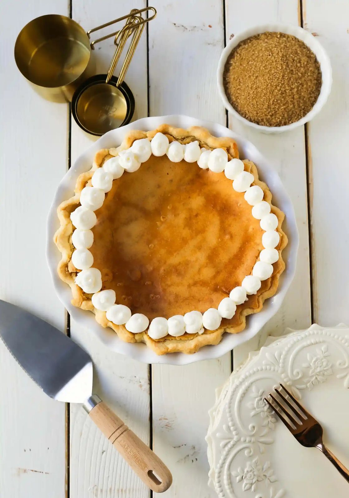 Creme Brûlée Pie. A silky smooth vanilla custard in a buttery crust topped with a crisp sugar topping. It is a creamy sweet pie with a touch of tang and will be everyone's favorite pie! www.modernhoney.com #thanksgiving #pie #pies #thanksgivingrecipes #cremebrulee