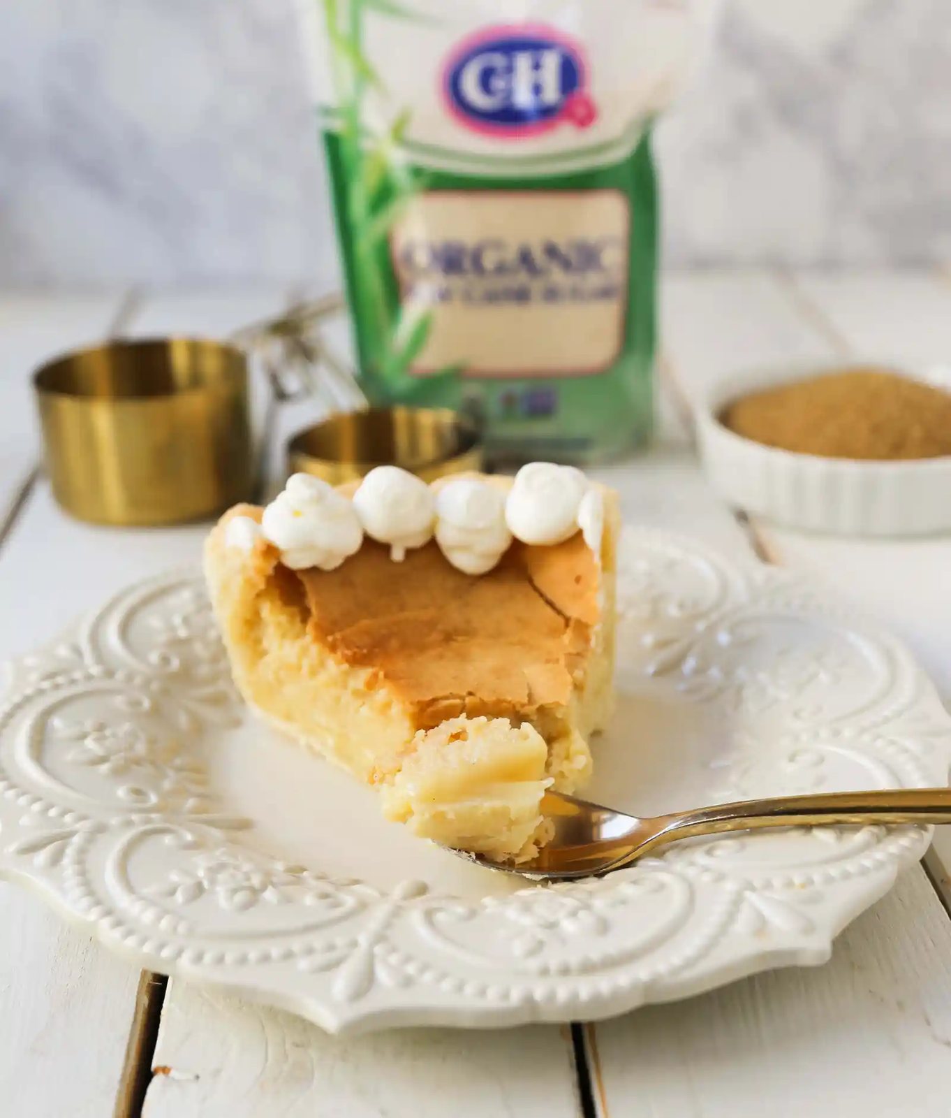 Creme Brûlée Pie. A silky smooth vanilla custard in a buttery crust topped with a crisp sugar topping. It is a creamy sweet pie with a touch of tang and will be everyone's favorite pie! www.modernhoney.com #thanksgiving #pie #pies #thanksgivingrecipes #cremebrulee