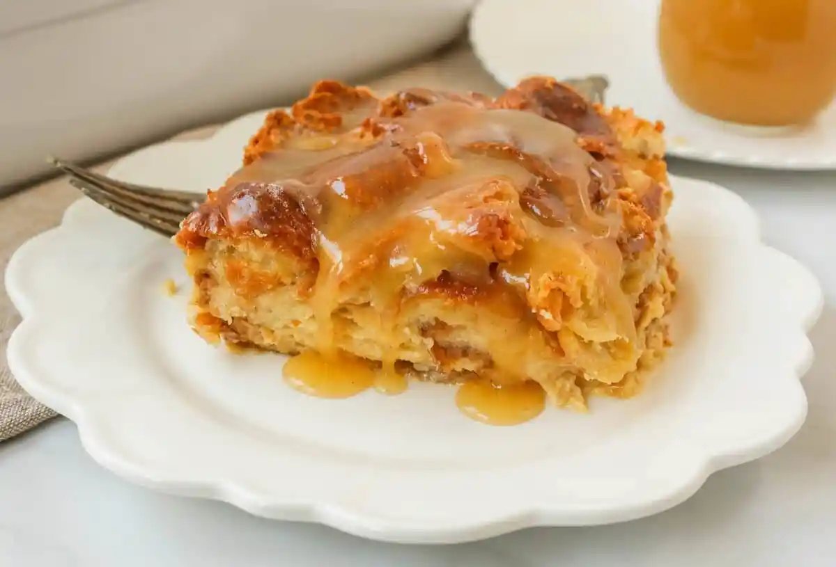 Croissant Bread Pudding with Vanilla Sauce is made with croissants baked in a custard sauce and topped with a homemade vanilla bean sauce. The most decadent dessert or breakfast recipe!