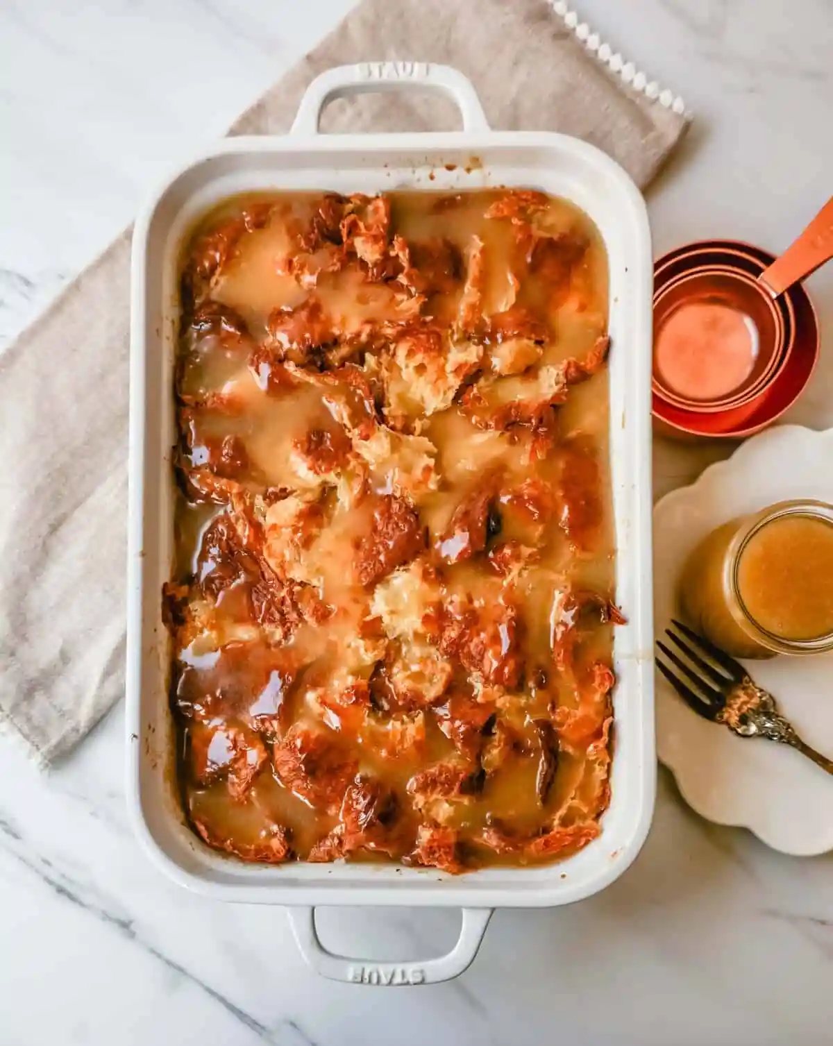 Croissant Bread Pudding with Vanilla Sauce is made with croissants baked in a custard sauce and topped with a homemade vanilla bean sauce. The most decadent dessert or breakfast recipe!