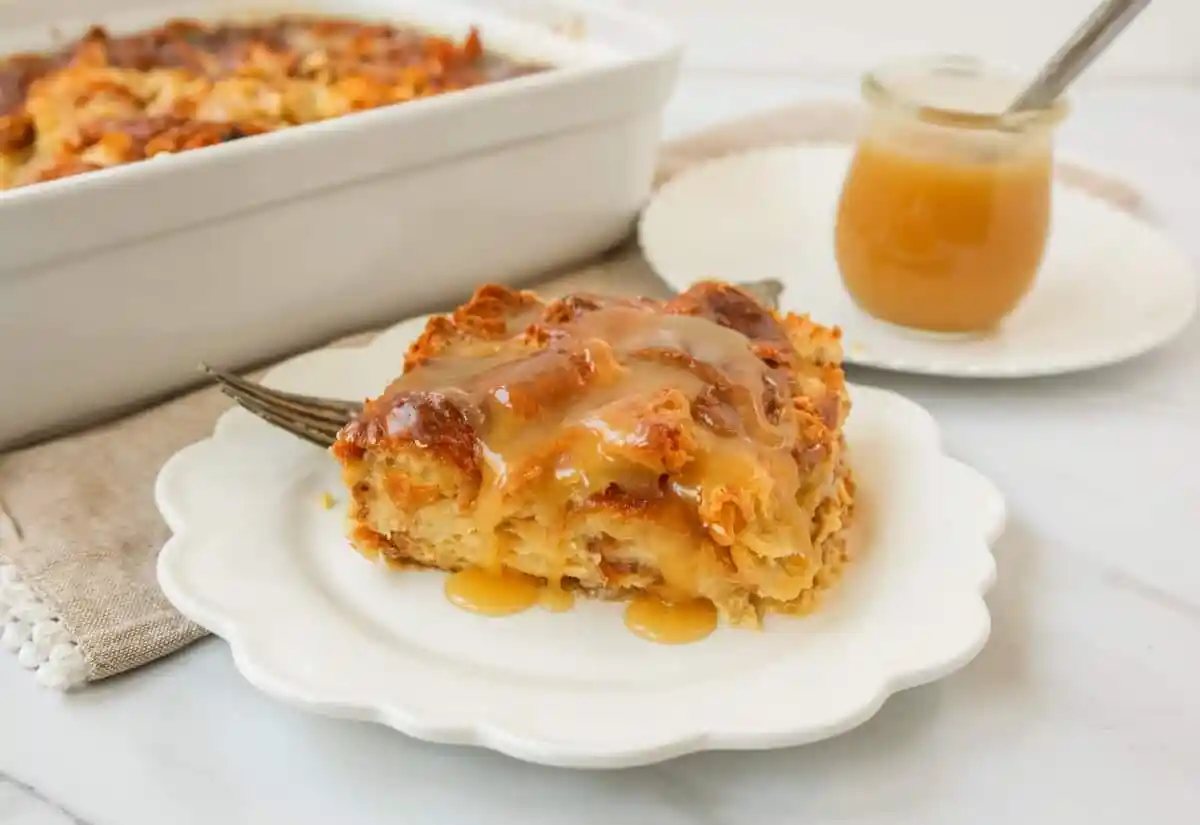 Croissant Bread Pudding with Vanilla Sauce is made with croissants baked in a custard sauce and topped with a homemade vanilla bean sauce. The most decadent dessert or breakfast recipe!