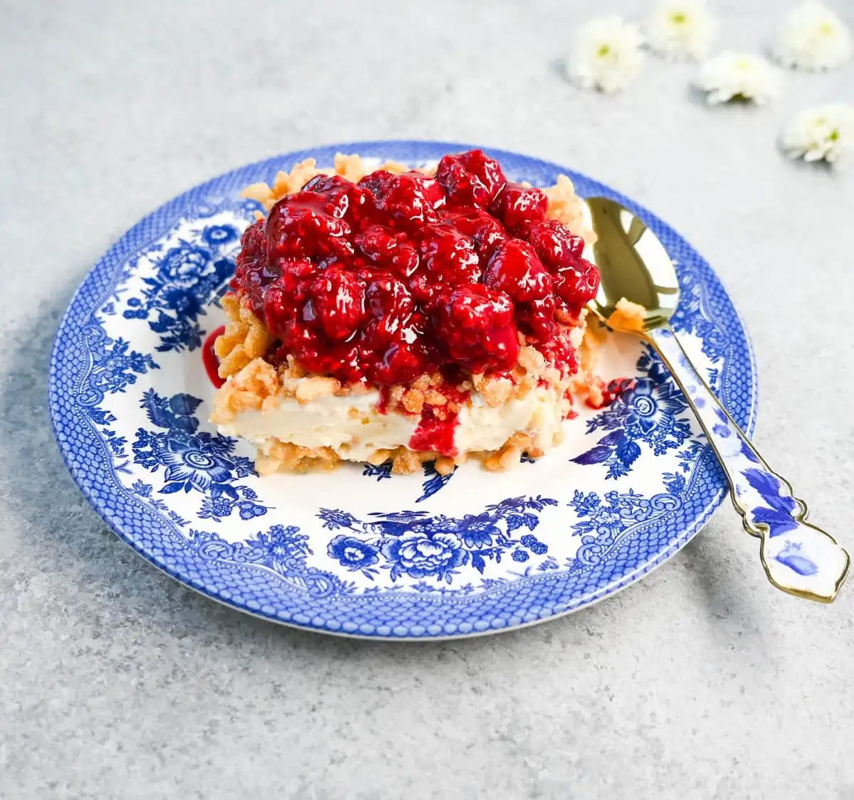 Crunchy Munchy Ice Cream Dessert. This popular ice cream dessert has a crunchy topping made with browned butter, sugar, and Rice Krispies cereal and is layered between vanilla ice cream and topped with a homemade raspberry sauce. The best ice cream dessert recipe!