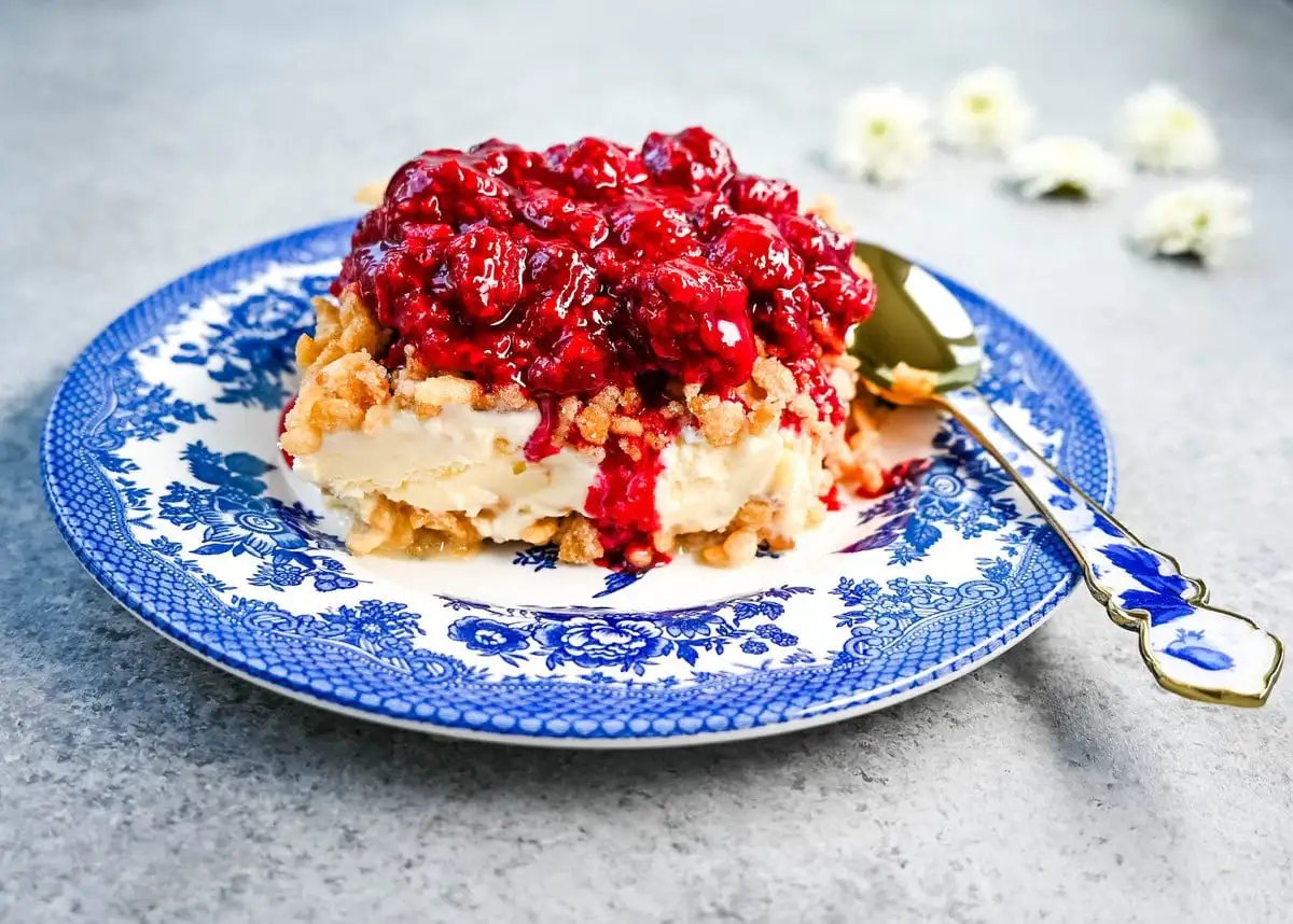 Crunchy Munchy Ice Cream Dessert. This popular ice cream dessert has a crunchy topping made with browned butter, sugar, and Rice Krispies cereal and is layered between vanilla ice cream and topped with a homemade raspberry sauce. The best ice cream dessert recipe!