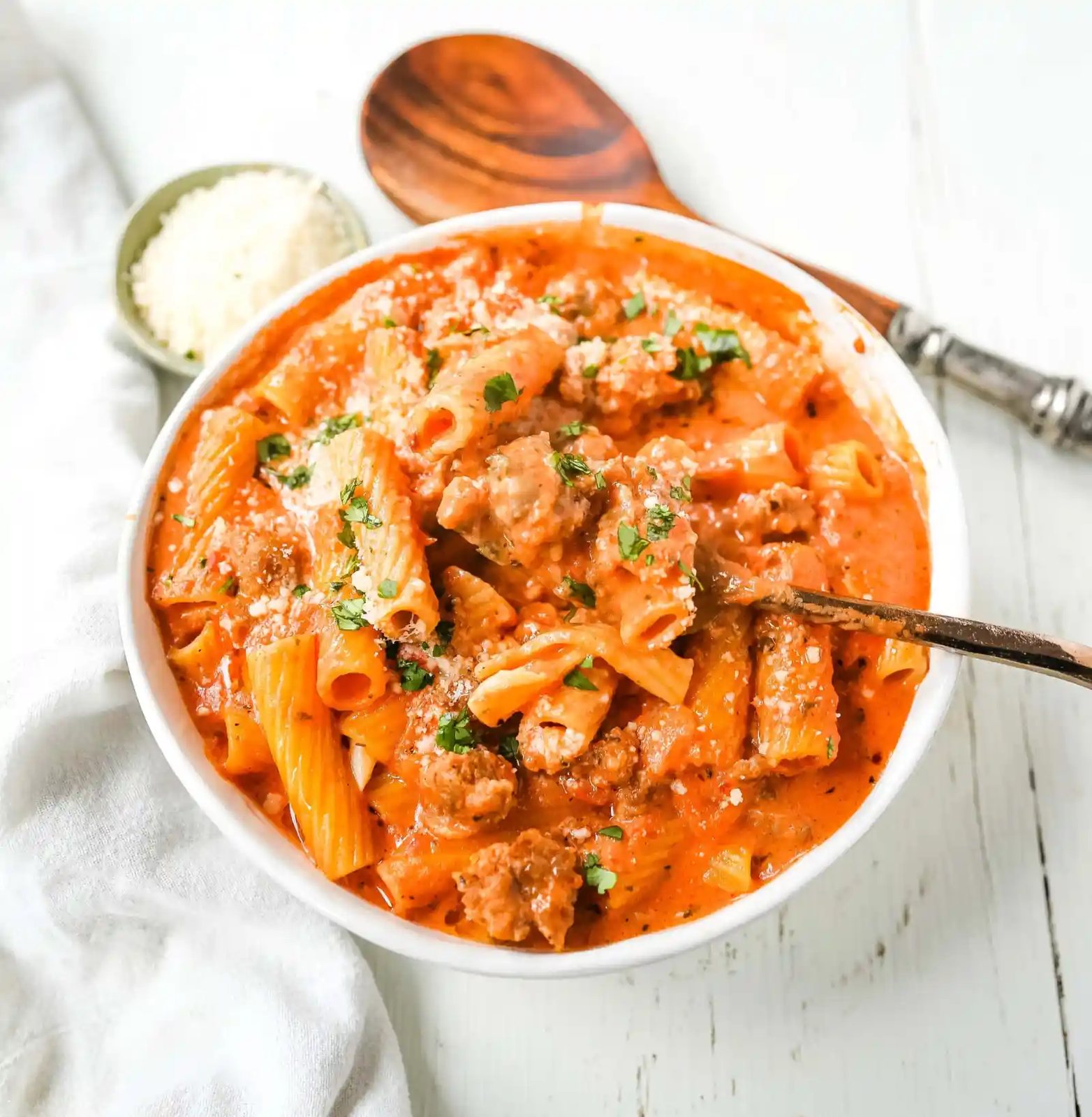 "Date Me" Creamy Sausage Rigatoni Pasta Homemade rich and creamy tomato cream and sausage sauce tossed with rigatoni and topped with parmesan cheese. The best creamy sausage rigatoni pasta! #pasta #dinner