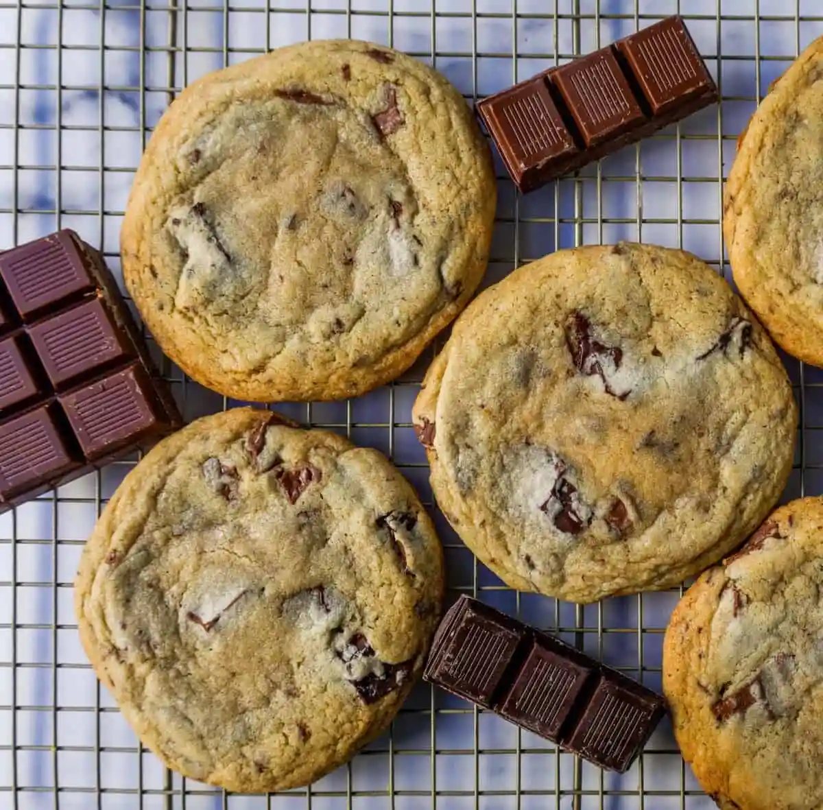 The famous Dominique Ansel Chocolate Chunk Cookie Recipe. How to make Dominique Ansel cookies at home. These chocolate chunk cookies are soft and chewy in the center with crisp edges and are full of melted chocolate.