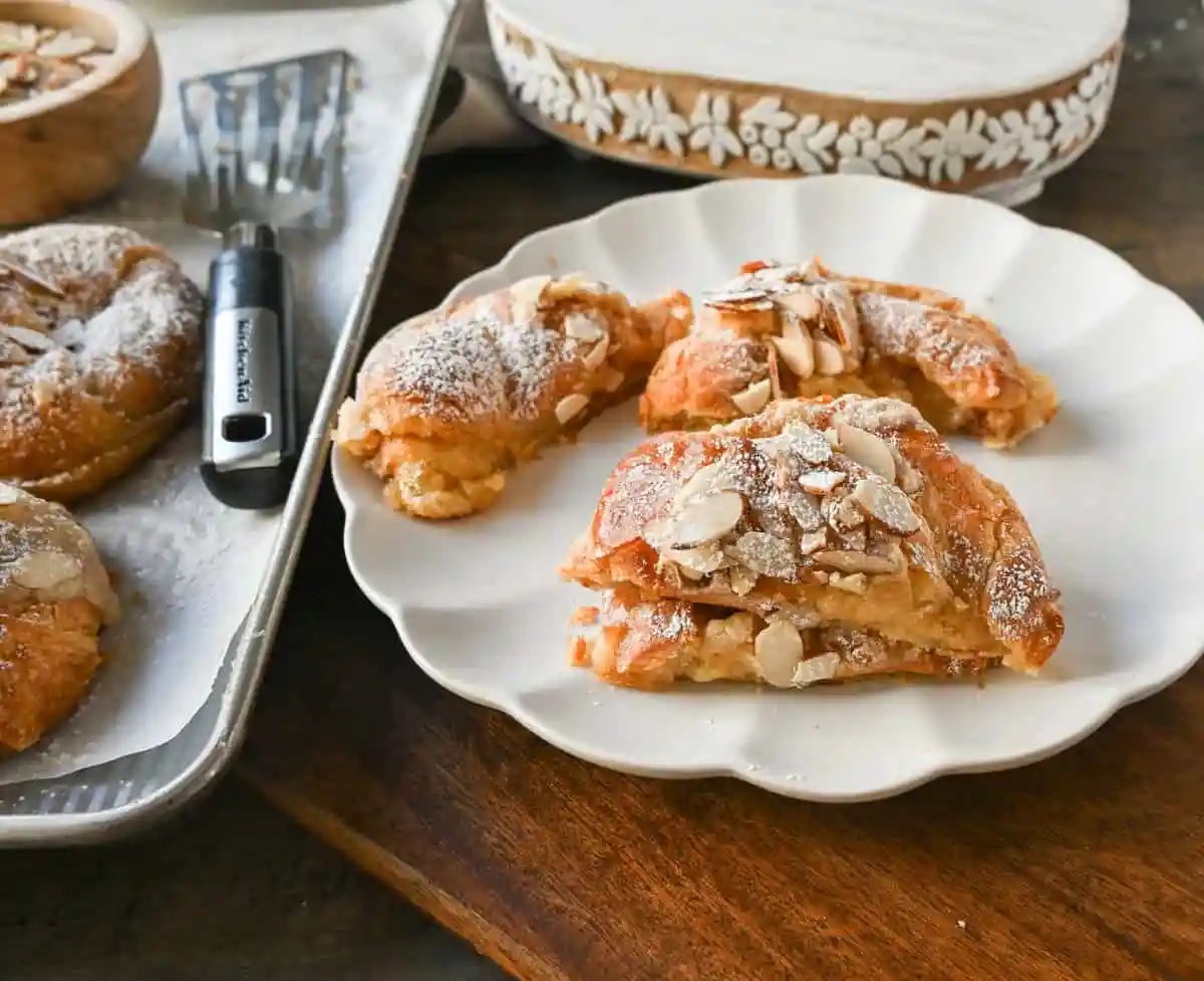 Easy Almond Croissants. How to make the easiest homemade almond croissants ever! These buttery, flaky croissants filled with a homemade almond filling and topped with crunchy almonds will rival any bakery. You can make these bakery-style almond croissants in 25 minutes!