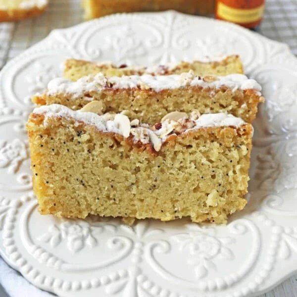 Almond Poppyseed Bread. Soft and moist poppyseed bread with vanilla bean almond glaze and candied almonds. The perfect poppyseed bread recipe.