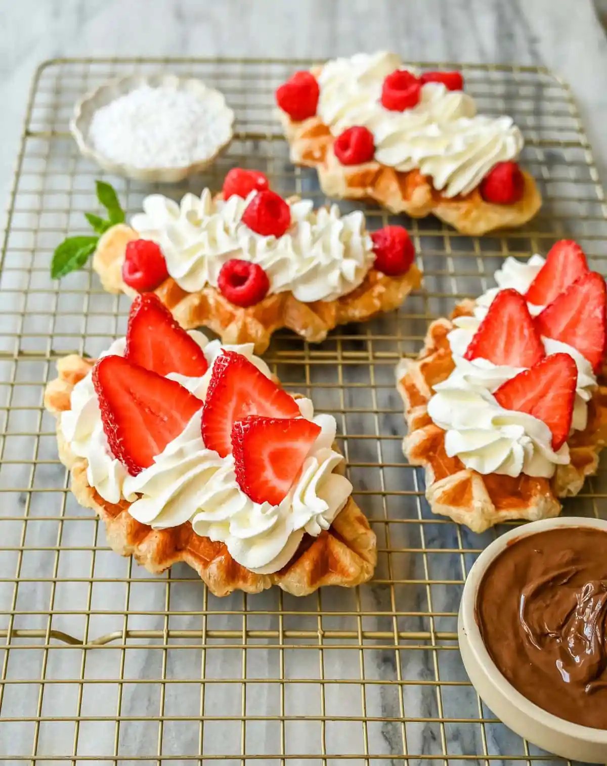 How to make the famous croffle which is croissant dough baked in a waffle iron that makes a buttery, flaky waffle that is the perfect breakfast or dessert recipe. A croffle is the ultimate fusion of a buttery, flaky croissant and a golden, crispy waffle. Top it with your favorite waffle toppings!