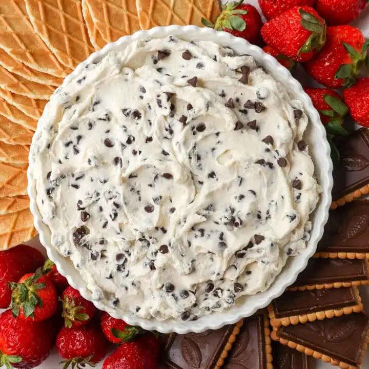 This is the Best Cannoli Dip Recipe made with ricotta cheese, mascarpone or cream cheese, powdered sugar, brown sugar, vanilla, and mini chocolate chips.