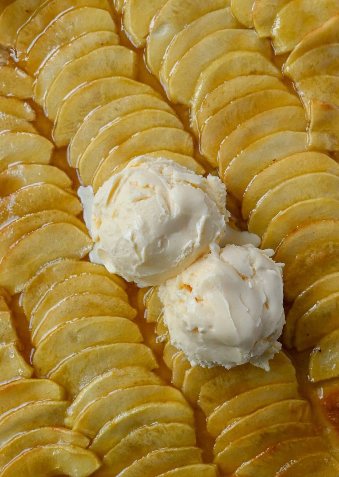 This homemade French Apple Tart recipe features a buttery crust, thinly sliced Granny Smith apples, and a golden apricot glaze for a bakery-style dessert. This Ina Garten French Apple Tart recipe is the best apple tart recipe, perfect for entertaining, holidays or any Fall baking.