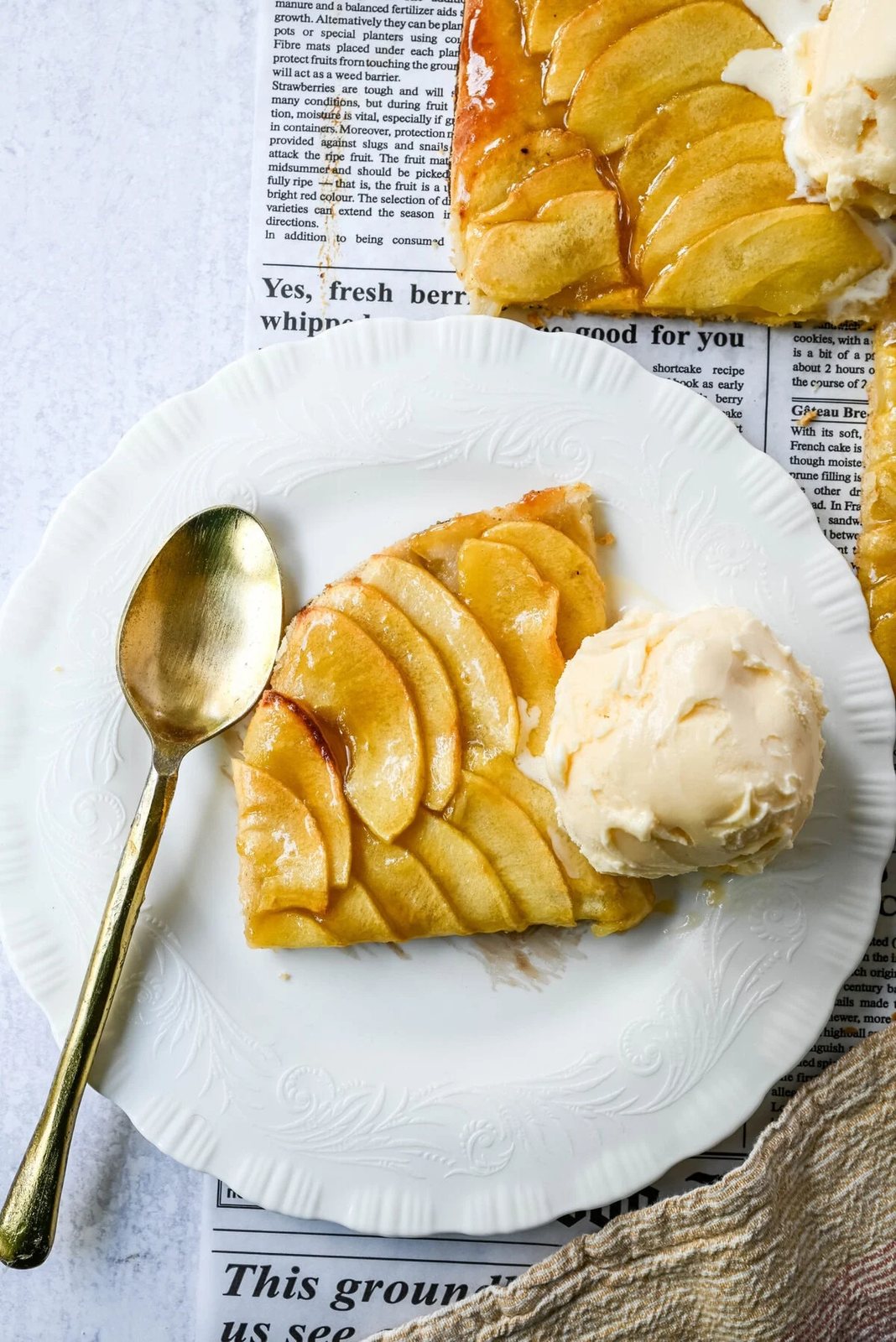 This homemade French Apple Tart recipe features a buttery crust, thinly sliced Granny Smith apples, and a golden apricot glaze for a bakery-style dessert. This Ina Garten French Apple Tart recipe is the best apple tart recipe, perfect for entertaining, holidays or any Fall baking.
