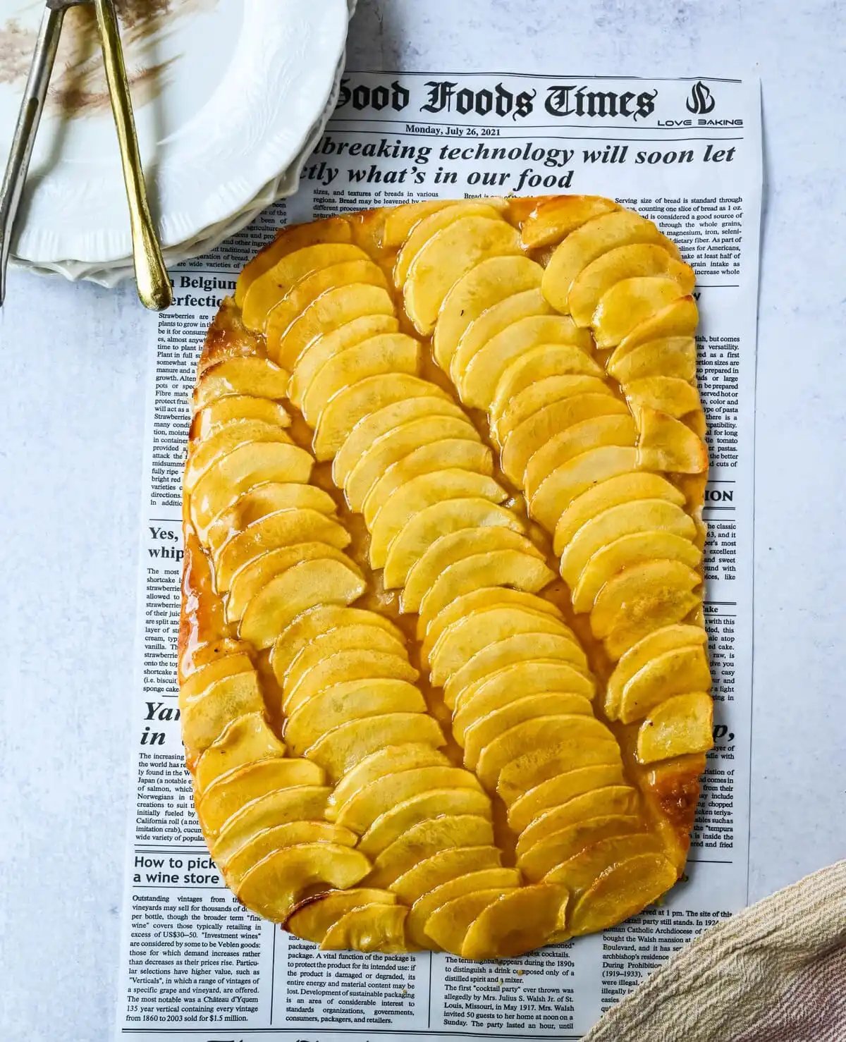 This homemade French Apple Tart recipe features a buttery crust, thinly sliced Granny Smith apples, and a golden apricot glaze for a bakery-style dessert. This Ina Garten French Apple Tart recipe is the best apple tart recipe, perfect for entertaining, holidays or any Fall baking.