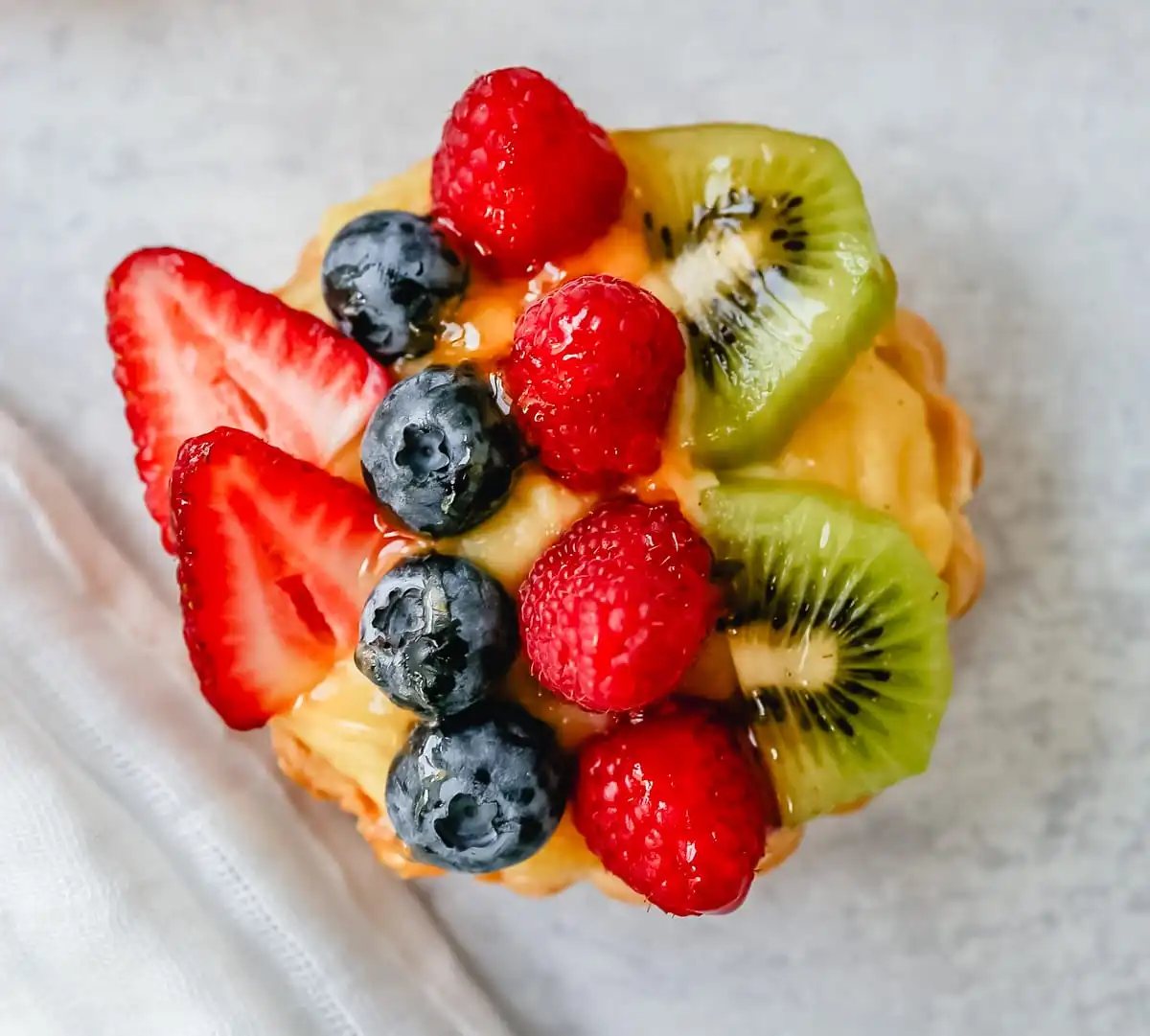 Fruit Tart with Pastry Cream This French fruit tart is made with a flaky, buttery pie crust, filled with homemade vanilla bean pastry cream, and topped with fresh fruit.