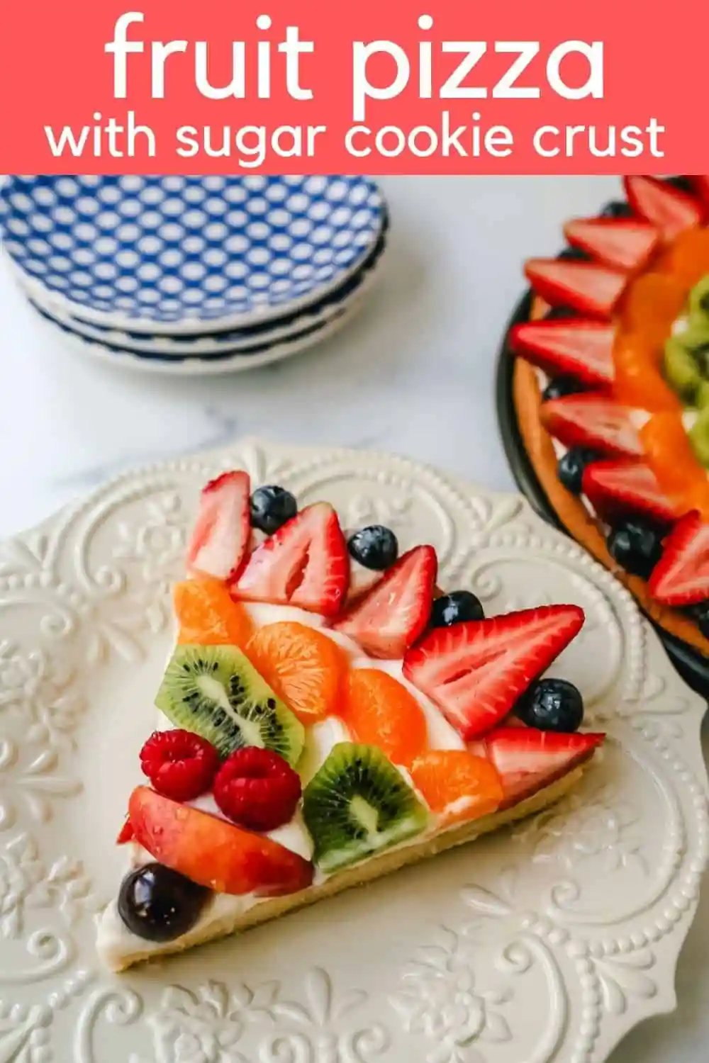 Fruit Pizza with a Sugar Cookie Crust is made with a large, pizza-sized baked sugar cookie and topped with a sweet cream cheese whipped cream and sprinkled with glazed fresh fruit.