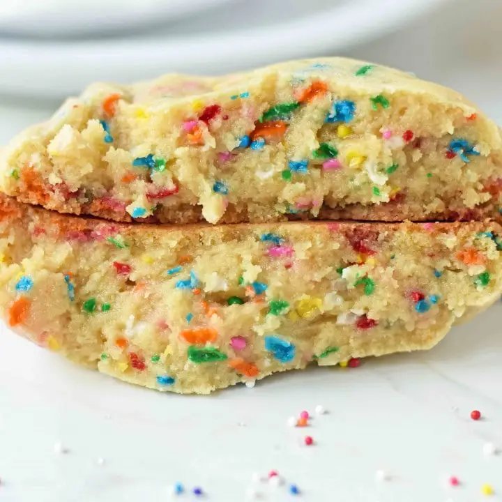 These thick, soft, bakery-style funfetti cookies are packed with rainbow sprinkles and flavored with a touch of almond extract. Made completely from scratch with simple pantry ingredients and a few game-changing bakery tricks, these cookies come out perfectly thick and golden at the edges and soft in the center. This is the only funfetti cookie recipe you will ever need.