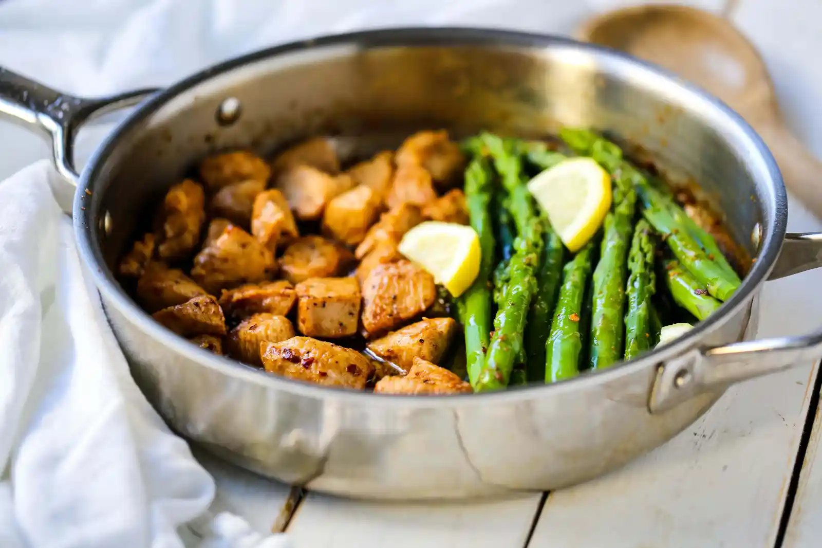 Garlic Butter Chicken and Asparagus Skillet A quick and easy one skillet dinner made with sautéed chicken and asparagus tossed in garlic butter. www.modernhoney.com #chicken #skilletdinner #chickendinner