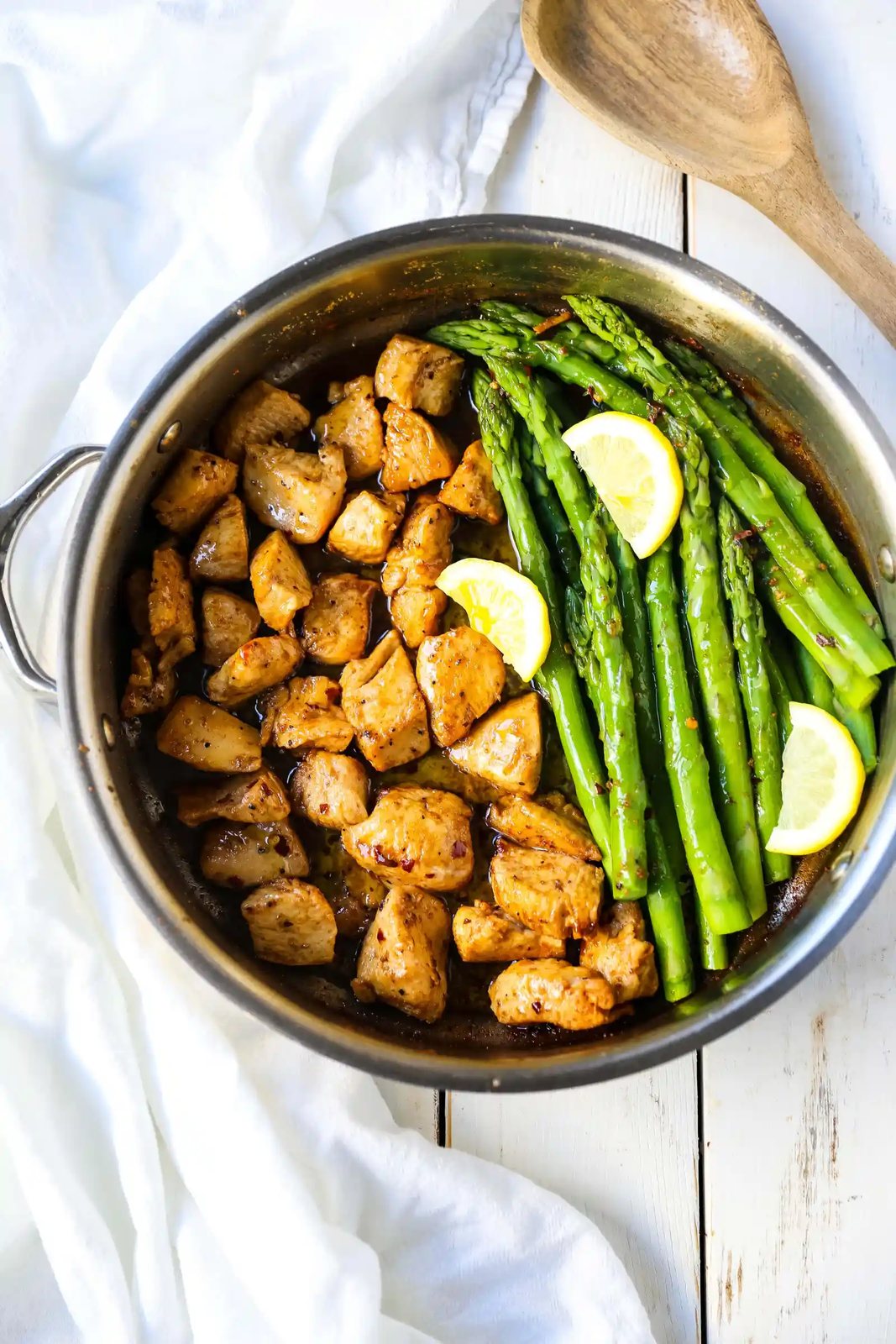 Garlic Butter Chicken and Asparagus Skillet A quick and easy one skillet dinner made with sautéed chicken and asparagus tossed in garlic butter. www.modernhoney.com #chicken #skilletdinner #chickendinner