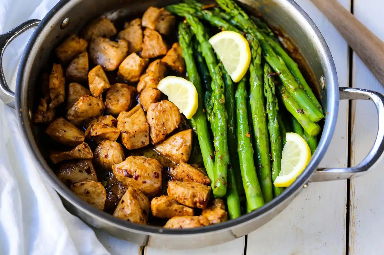 Garlic Butter Chicken and Asparagus Skillet A quick and easy one skillet dinner made with sautéed chicken and asparagus tossed in garlic butter. www.modernhoney.com #chicken #skilletdinner #chickendinner