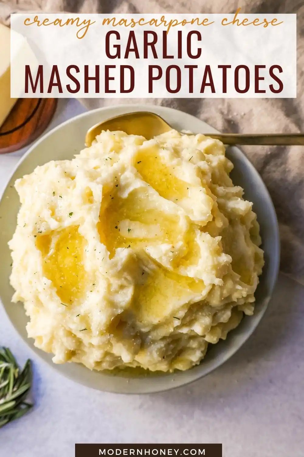 Creamy, Buttery Garlic Mashed Potatoes made with potatoes creamed with butter, garlic, mascarpone cheese, cream, and salt. The creamiest garlic mashed potatoes recipe!