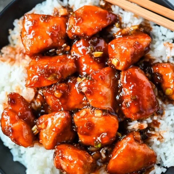 This sticky honey gochujang chicken is a quick and easy 30-minute dinner recipe with Korean-inspired flavor. Juicy chicken breast is coated in a sweet, spicy glaze made with honey, garlic, soy sauce, and gochujang paste for a perfect melt-in-your-mouth texture. Serve it over coconut rice or noodles for a simple easy dinner recipe!