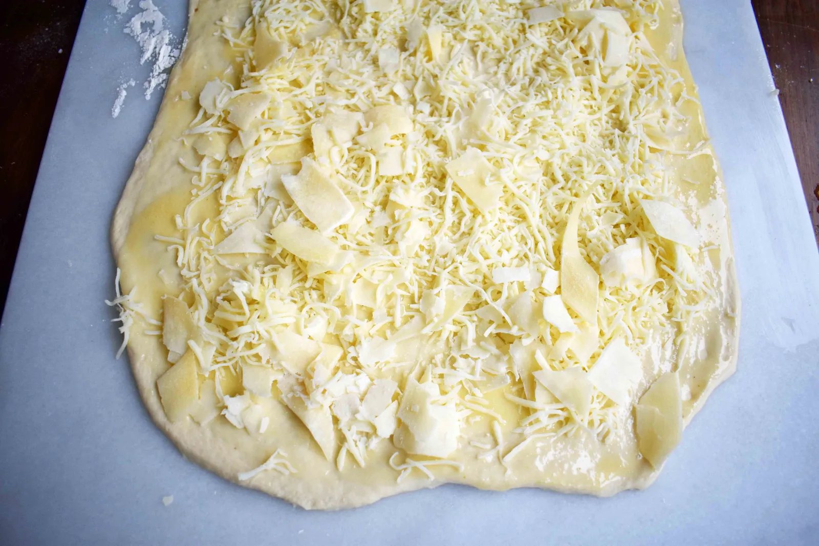 Golden's Garlic Parmesan Cheese Rolls by Modern Honey. Made with 5 simple ingredients -- pizza dough, butter, garlic powder, parmesan and mozzarella cheese.