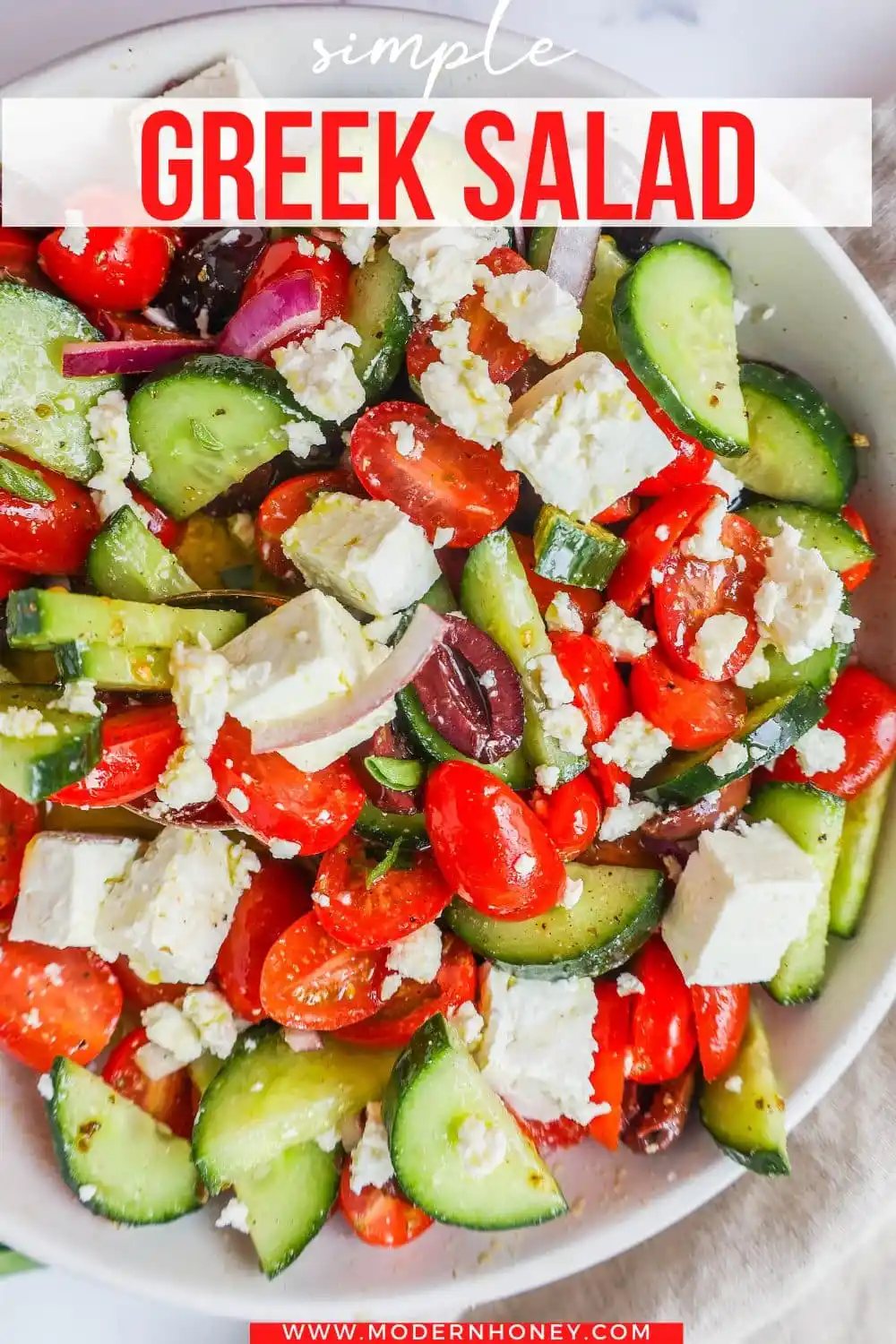 This simple Greek Salad is made with fresh tomatoes, cucumbers, red onion, kalamata olives, feta cheese, and all tossed with a homemade tangy Greek dressing.