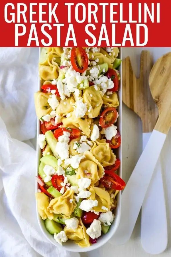 Greek Tortellini Pasta Salad. Cheese Tortellini Pasta tossed with fresh tomatoes, cucumbers, red onion, feta cheese, in a homemade Greek dressing. www.modernhoney.com #sidedish #pastasalad #salad #potluck