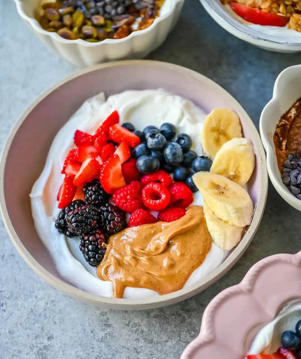 Peanut Butter Berry Yogurt Bowl. Greek yogurt, natural peanut butter, strawberries, raspberries, blackberries, blueberries, bananas.