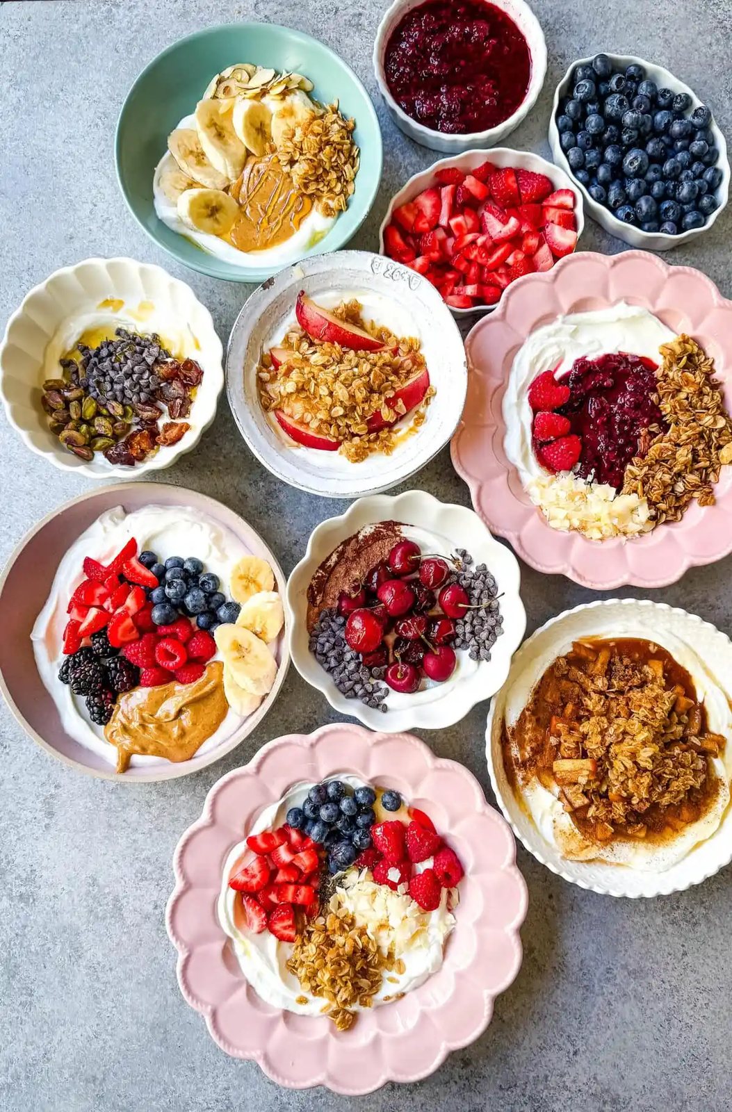 Greek Yogurt Breakfast Bowls start with rich creamy yogurt, topped with fresh fruits, nuts, granola, and superfoods for a perfect start to the day! How to make the best Greek yogurt bowls with toppings. You will find over 20+ Greek Yogurt Bowl combinations with different topping ideas for high protein yogurt bowls, what toppings pair well with greek yogurt, and recipes.