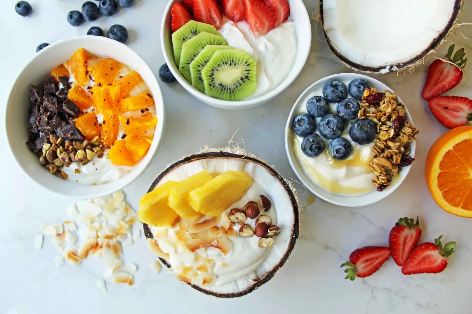 Greek Yogurt Breakfast Bowls with Toppings by Modern Honey. Healthy Greek Yogurt topped with fresh fruits, nuts, and honey. It's a perfect breakfast to start the day!