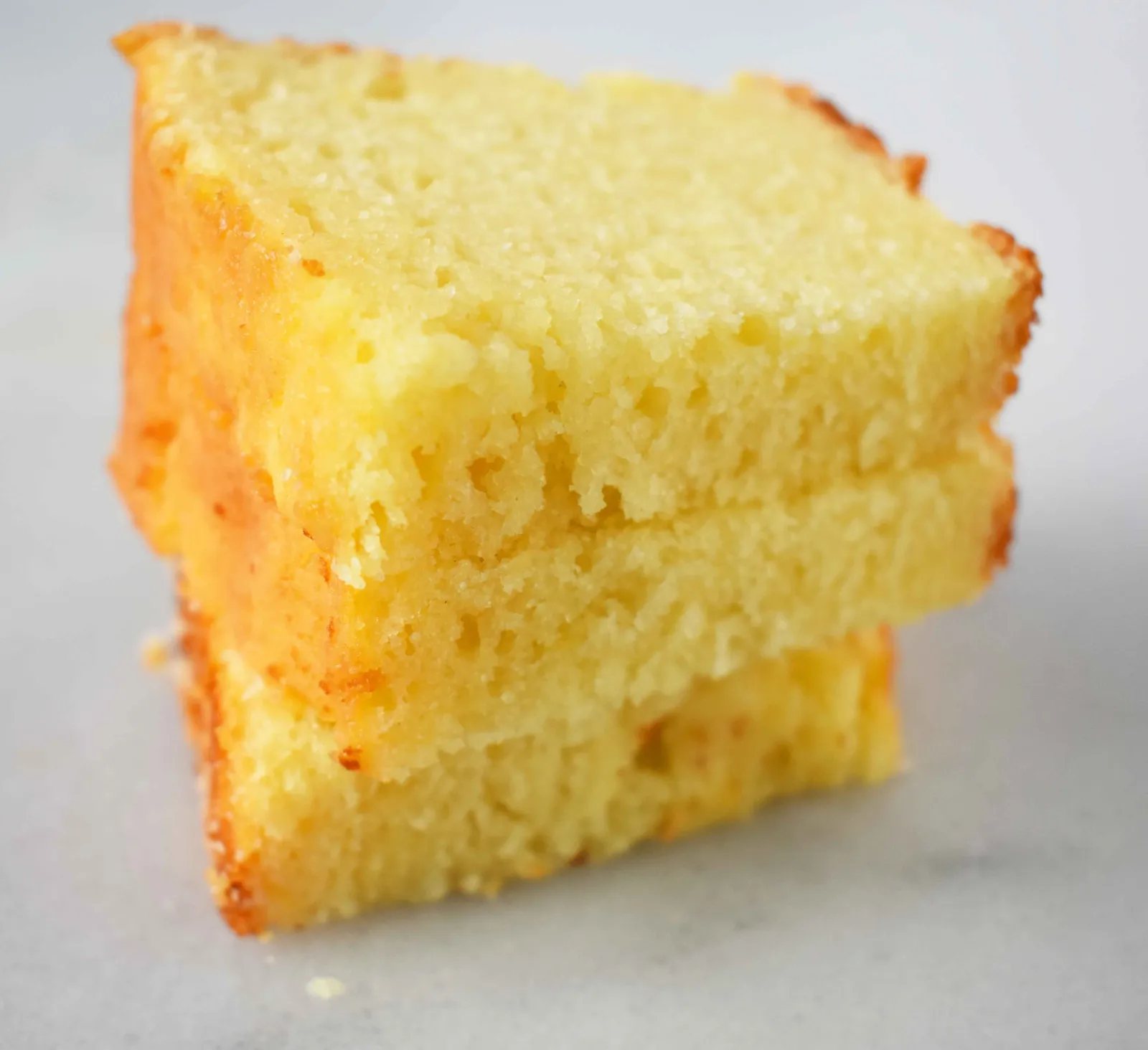 Greek Yogurt Lemon Bread with Vanilla Bean Glaze and Coconut. Sweet and moist lemon yogurt cake topped with creamy vanilla glaze. www.modernhoney.com
