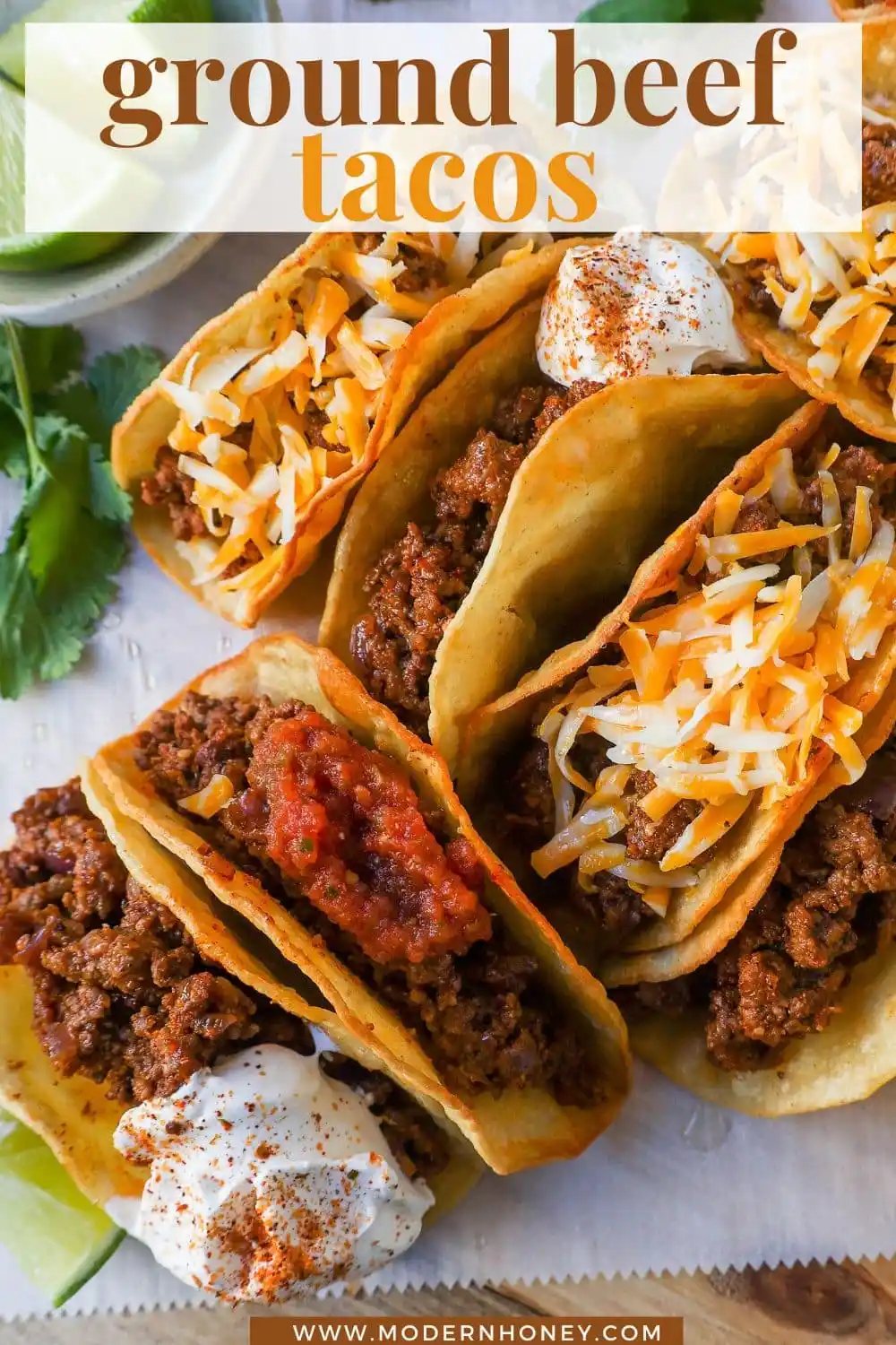 These homemade Ground Beef Tacos are made with spiced taco meat loaded into fried taco shells. Top with your favorite toppings for an easy 30-minute meal!