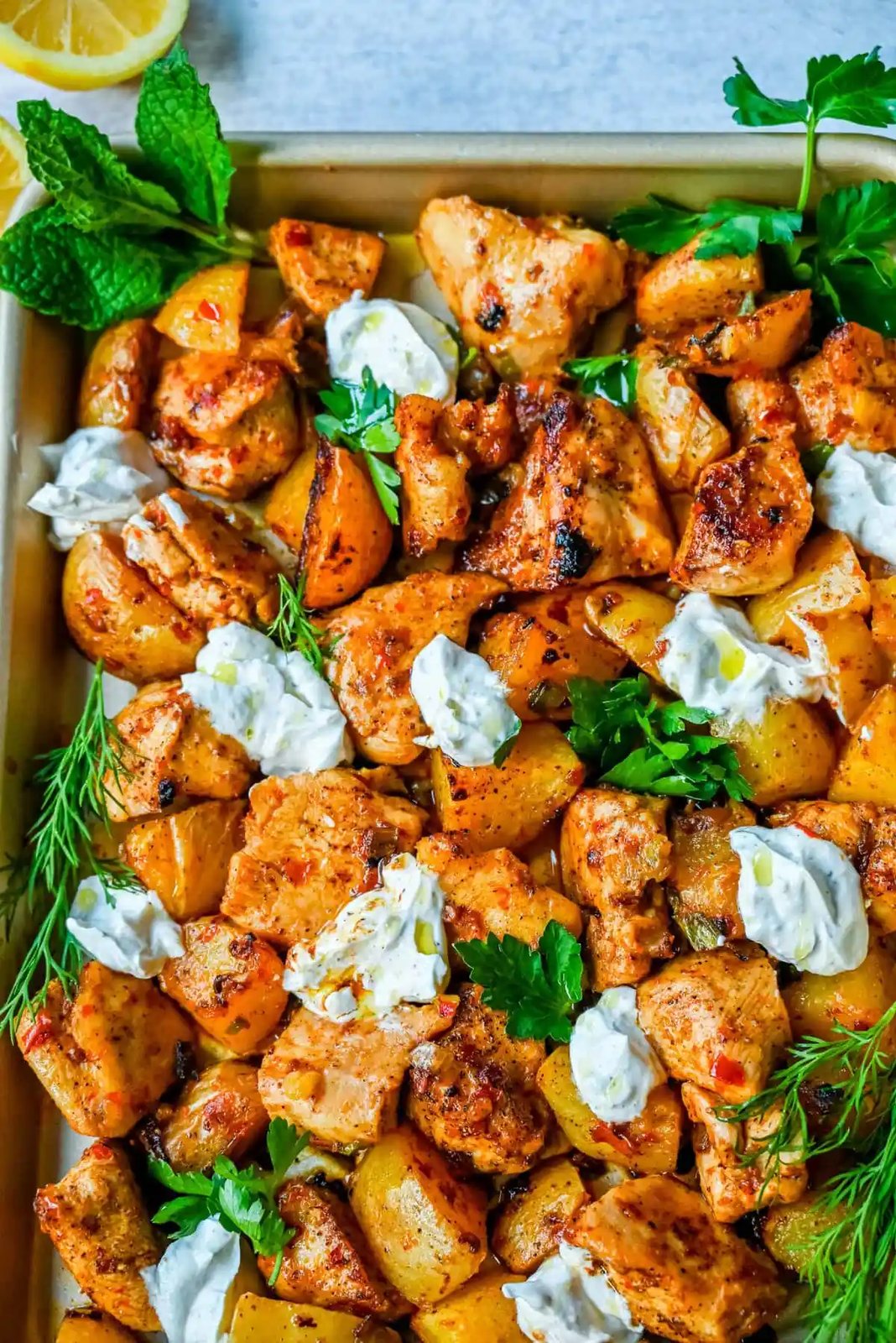 This Harissa Chicken and Roasted Potatoes recipe is a flavorful one-pan meal with juicy chicken breasts coated in a spicy harissa sauce and roasted with golden potatoes until perfectly crispy. A sprinkle of herbs at the end brings balance to this North African–inspired dish. It’s easy, satisfying, and the perfect simple weeknight dinner!