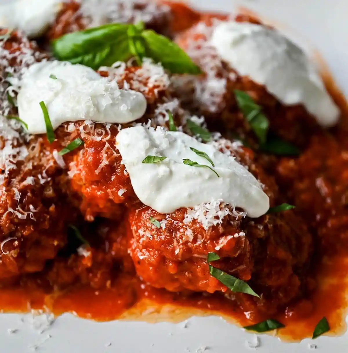 Learn how to make high protein chicken cottage cheese meatballs at home. This easy chicken parmesan meatballs recipe uses whipped cottage cheese, garlic, and parmesan for a juicy, protein-packed dinner that's ready in under 30 minutes. Here's the viral TikTok recipe made famous by Hailey Bieber.