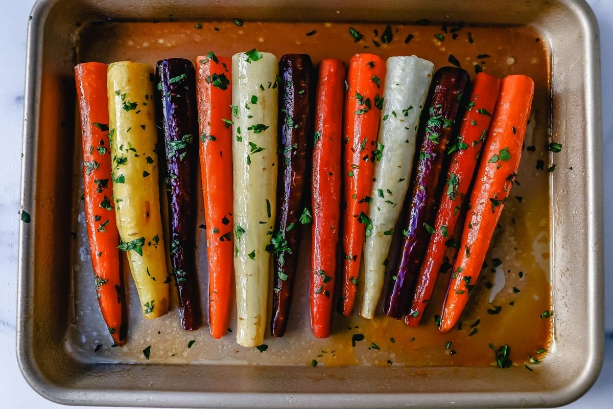 These roasted carrots are made with butter, honey, salt, and a touch of fresh lemon zest. These are the best honey glazed carrots and a perfect classic side dish.