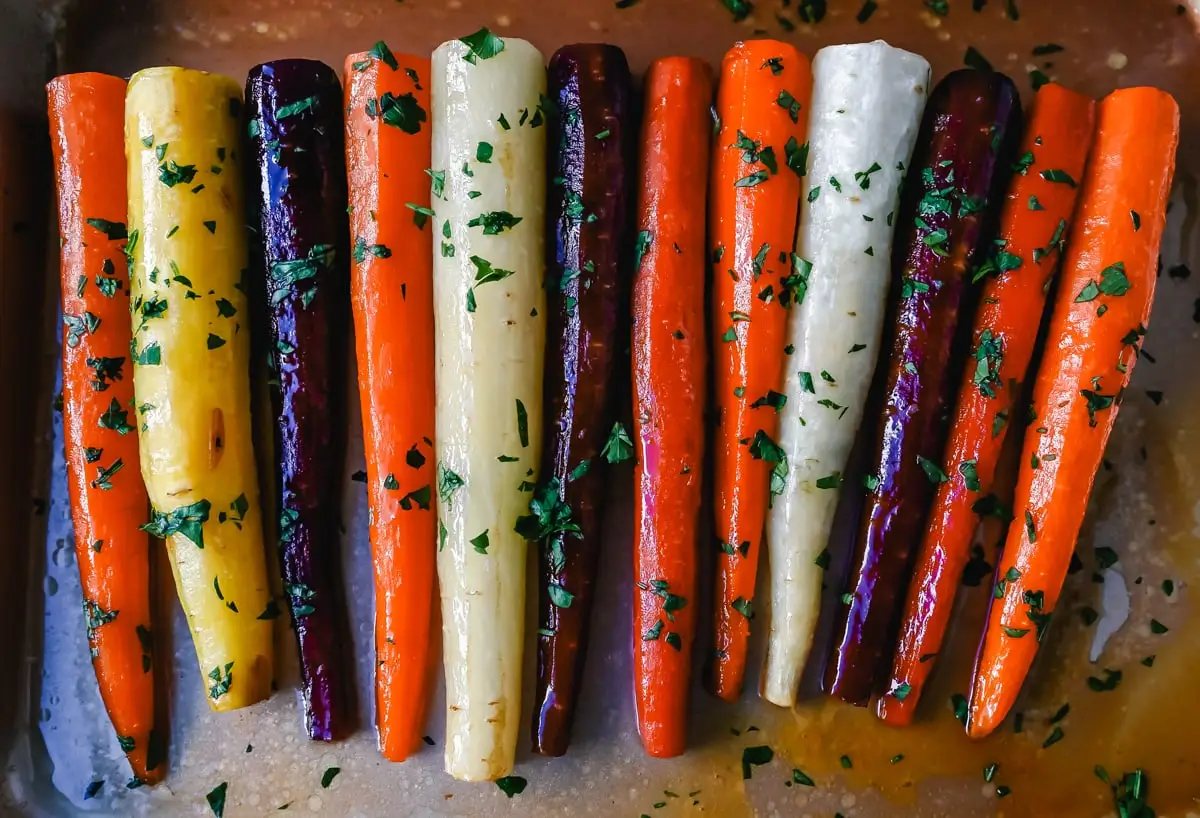 These roasted carrots are made with butter, honey, salt, and a touch of fresh lemon zest. These are the best honey glazed carrots and a perfect classic side dish.