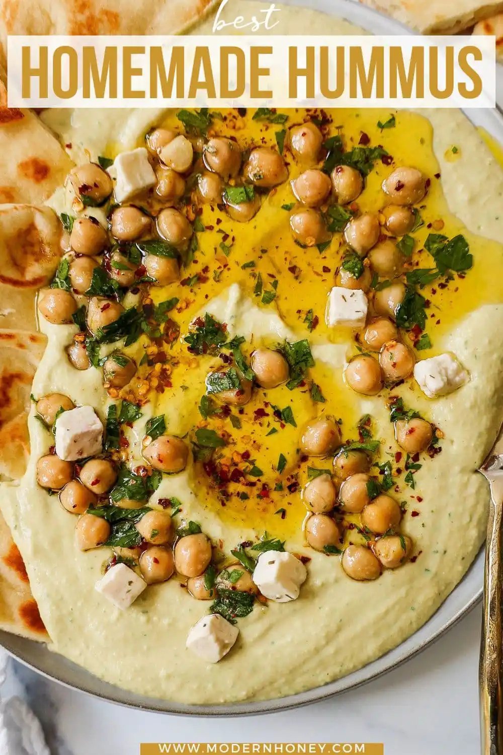 How to make authentic, creamy, homemade hummus made from scratch using simple ingredients -- chickpeas, tahini, garlic, olive oil, lemon juice, and salt. This is such an easy hummus recipe that everyone will love!