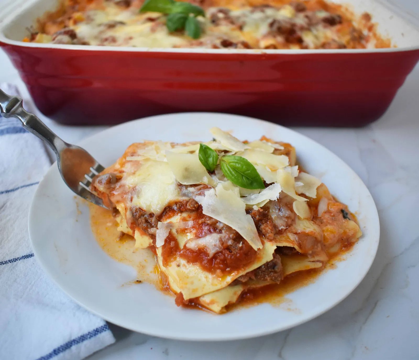 Italian Bolognese Lasagna. Authentic Italian recipe made with a traditional meat sauce, a creamy bechamel sauce, parmesan and mozzarella cheeses.