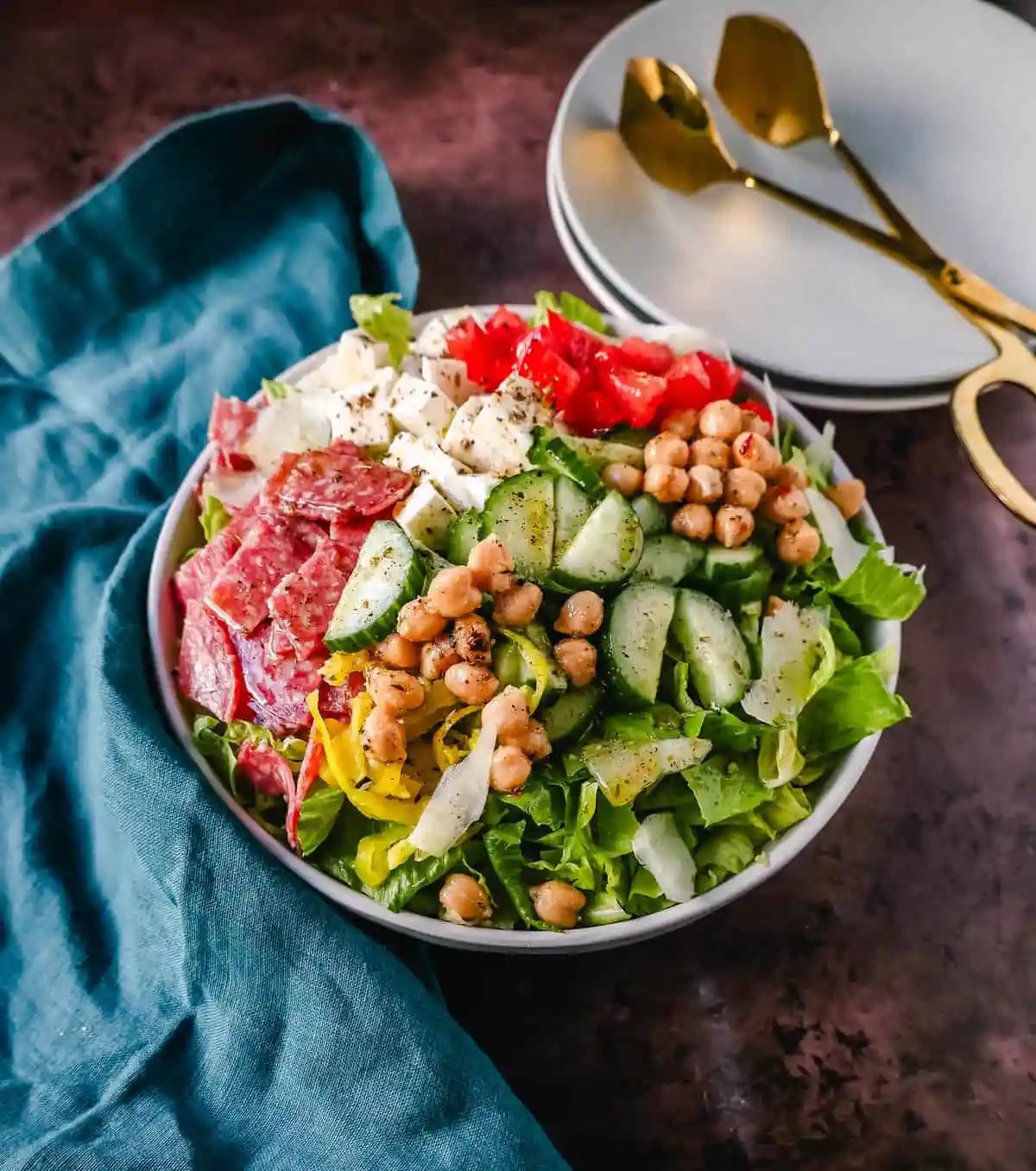 How to make the best Italian Chopped Salad made with Italian meats, cheeses, vegetables, and tossed with a homemade Italian dressing. This is the most flavor-packed salad recipe! This Italian Chop Salad is the perfect summer meal or side dish.